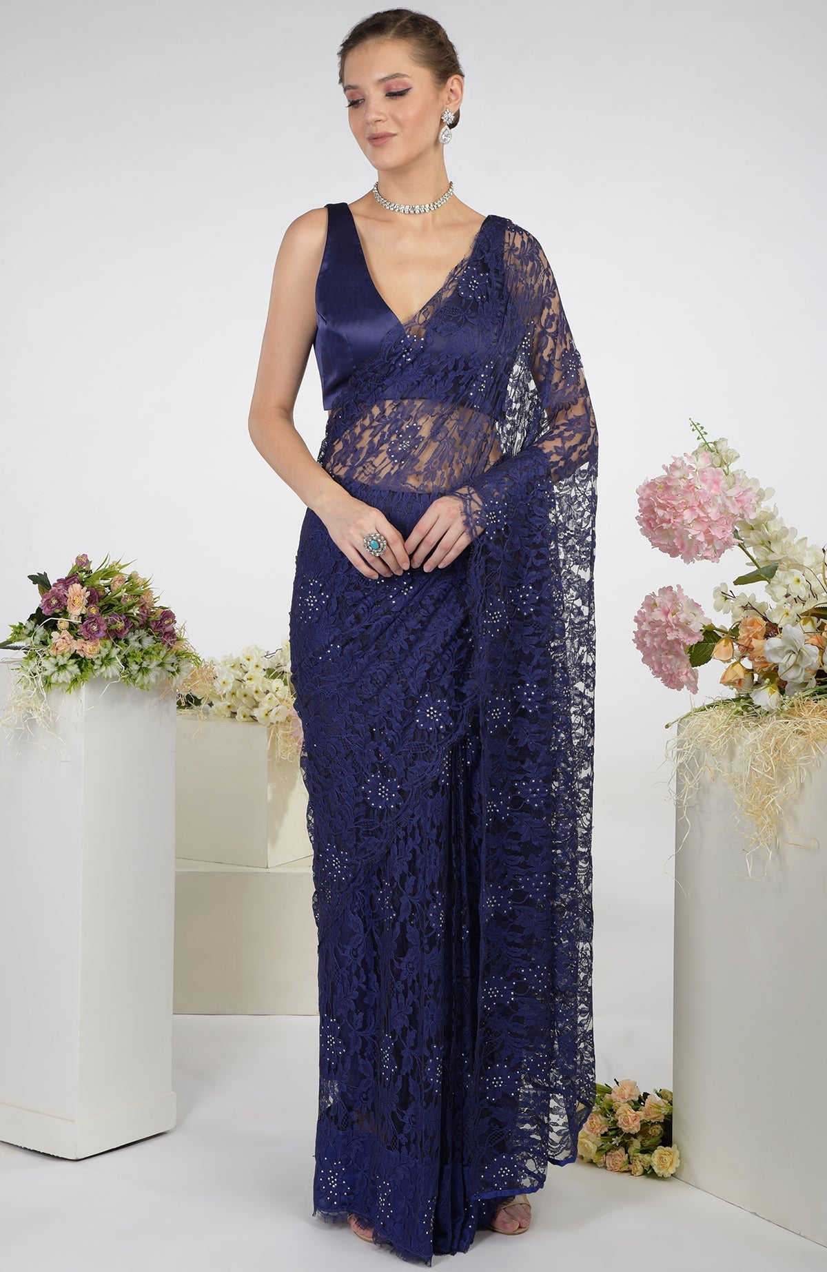 Eclipse blue French Chantilly lace saree with Swarovski crystals and a satin blouse.