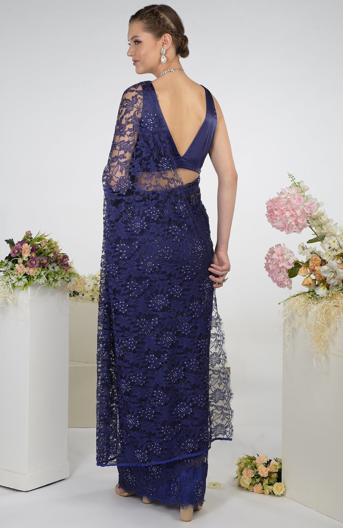 Eclipse blue French Chantilly lace saree with Swarovski crystals and a satin blouse.