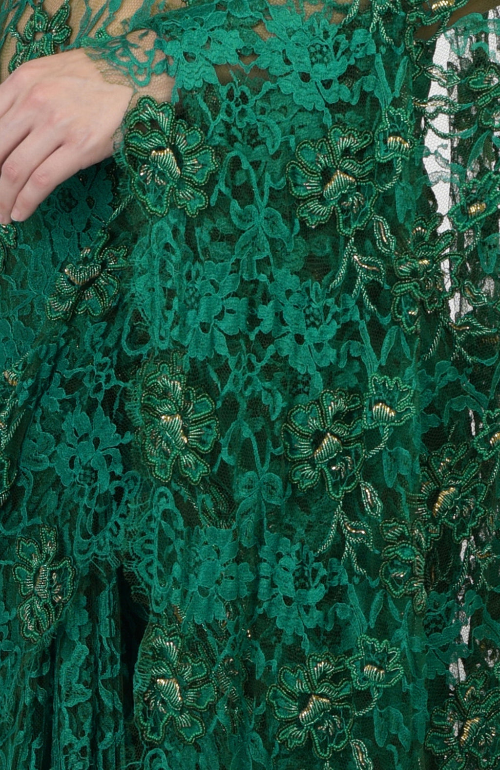 Emerald green French Chantilly saree with hand-embroidered floral motifs and gold highlights.