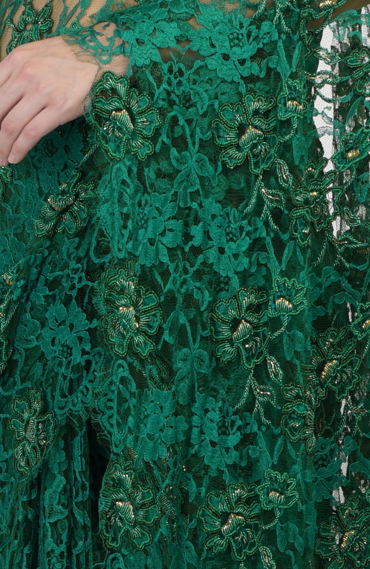 Emerald green French Chantilly saree with hand-embroidered floral motifs and gold highlights.