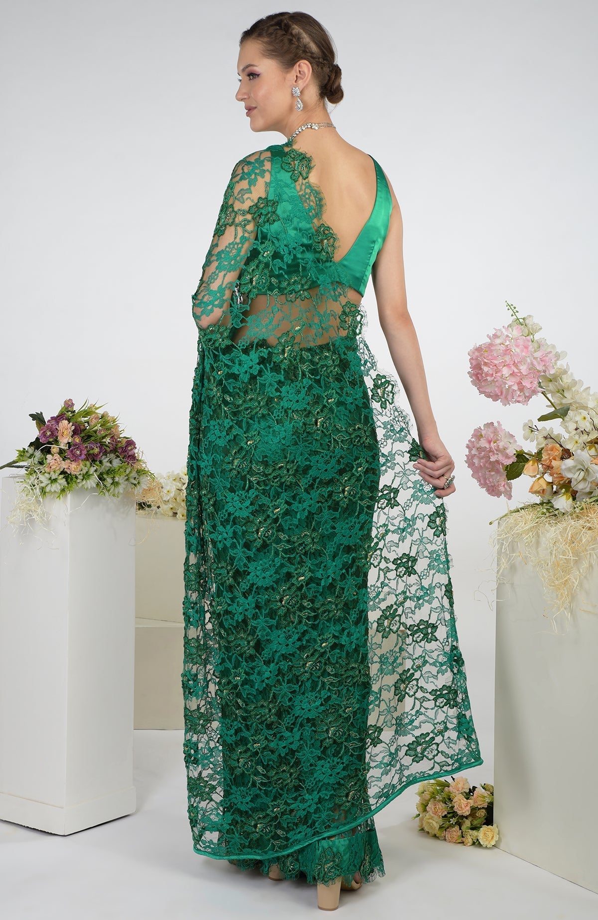 Emerald green French Chantilly hand-embroidered saree with a matching satin blouse.