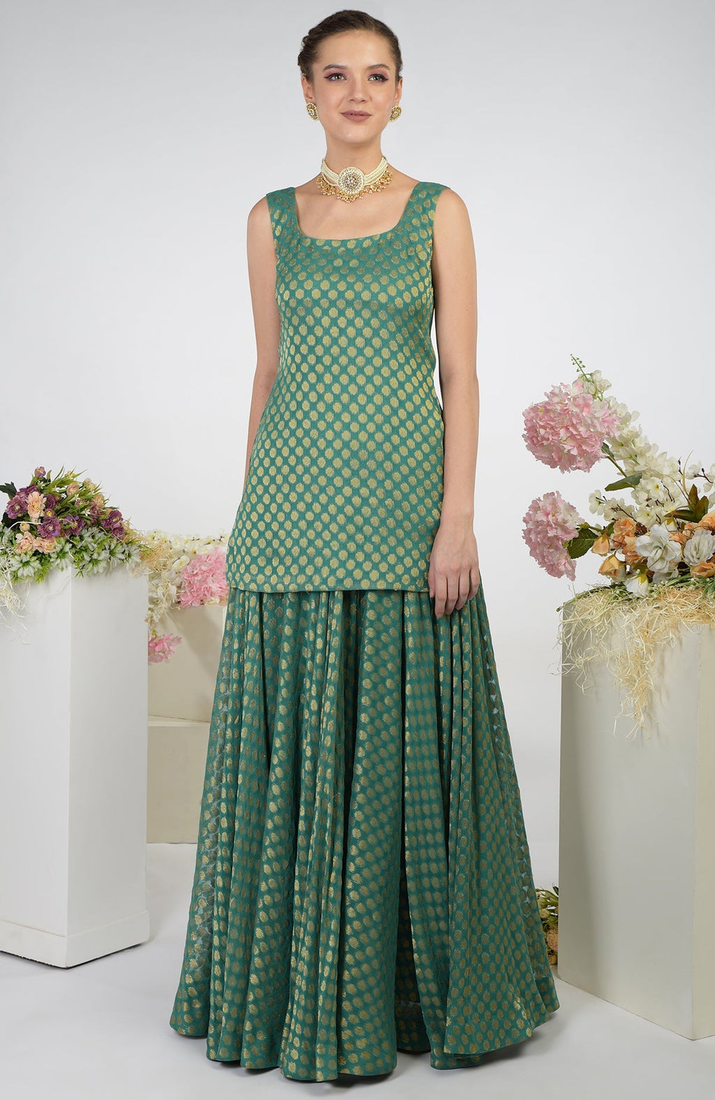 Bottle green Banarasi zardozi kalidaar skirt set with gold polka dots.