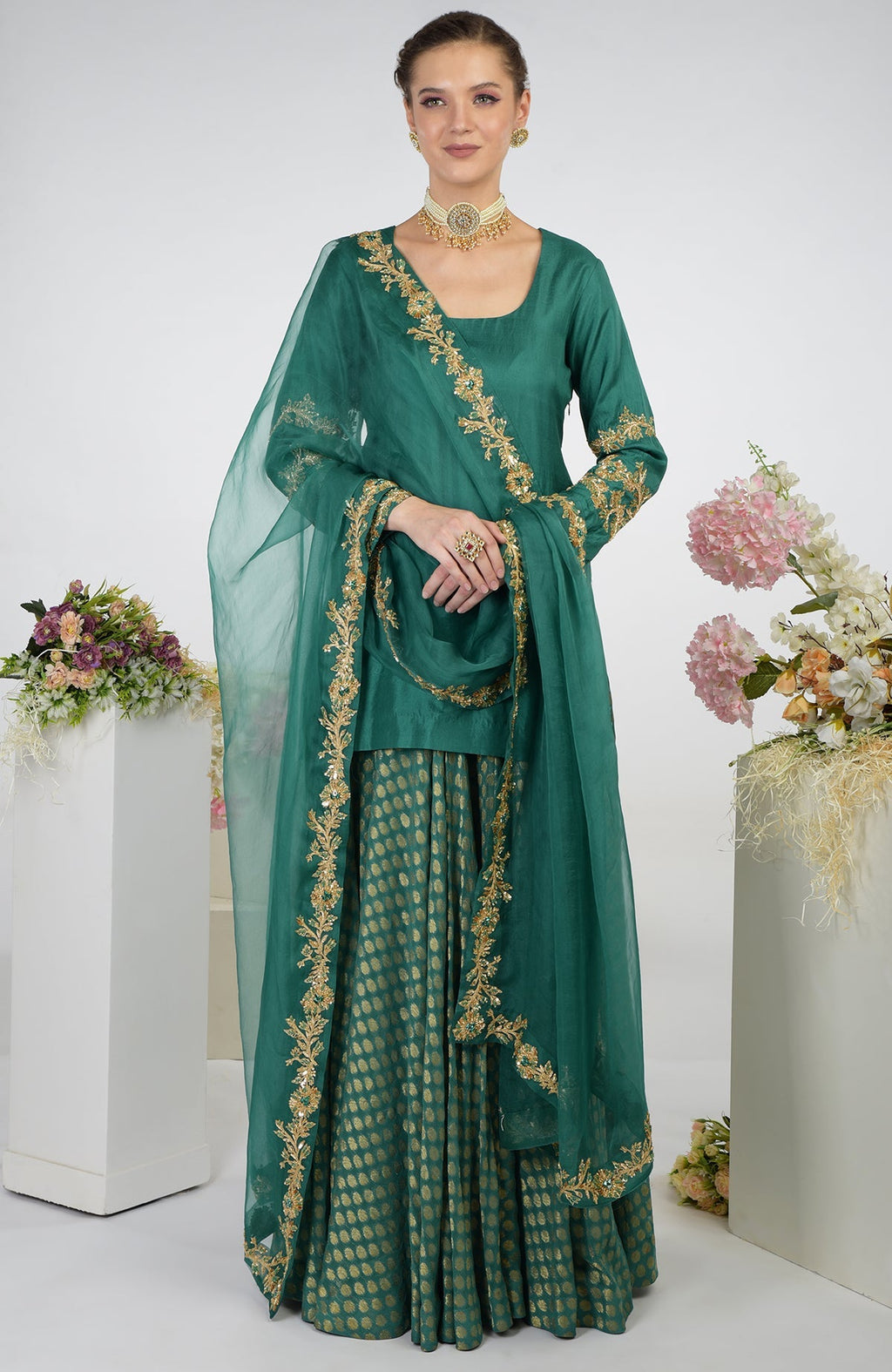 Bottle Green Banarasi Zardozi Kalidaar Skirt Set with a short tunic and embroidered dupatta.