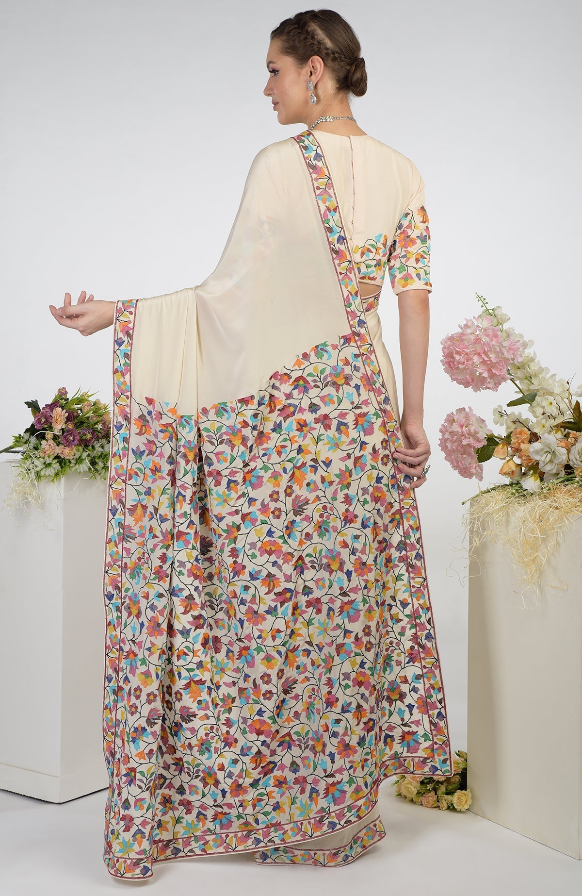 Butter cream pure crepe silk saree with multi-color Kashmir Kani art embroidery.