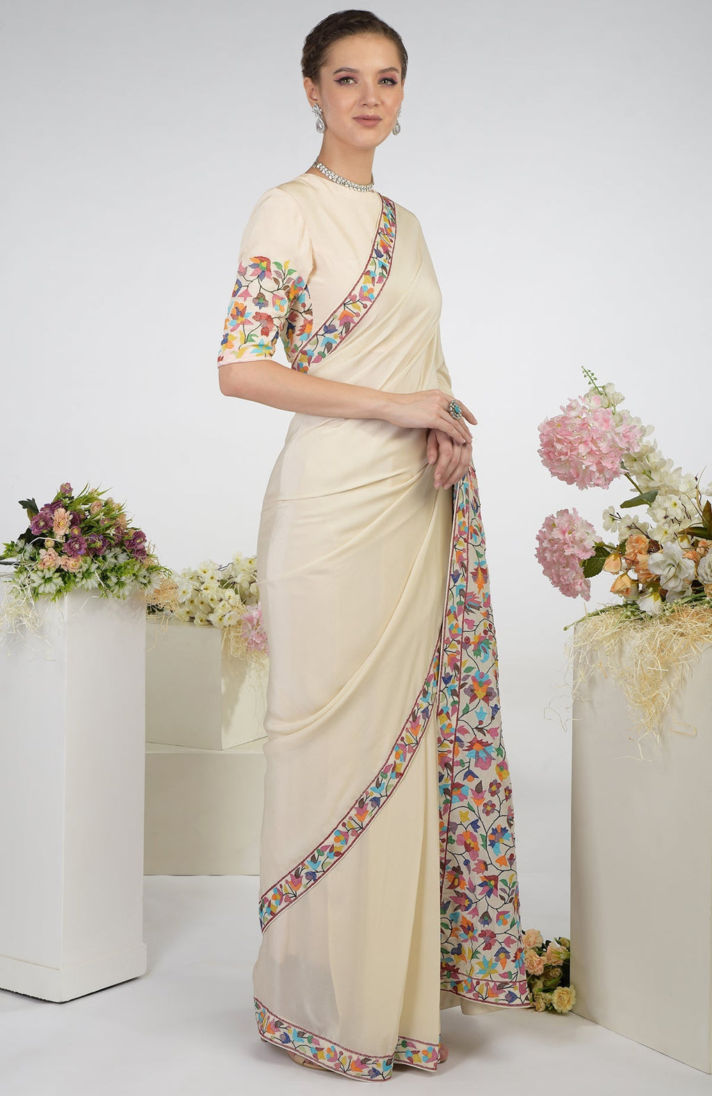 Butter cream pure crepe silk saree with multicolor Kani art embroidery.