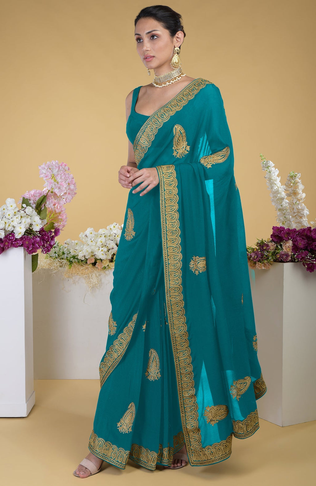 Peacock blue-gold Kashmiri tilla aari embroidered saree with paisley motifs.