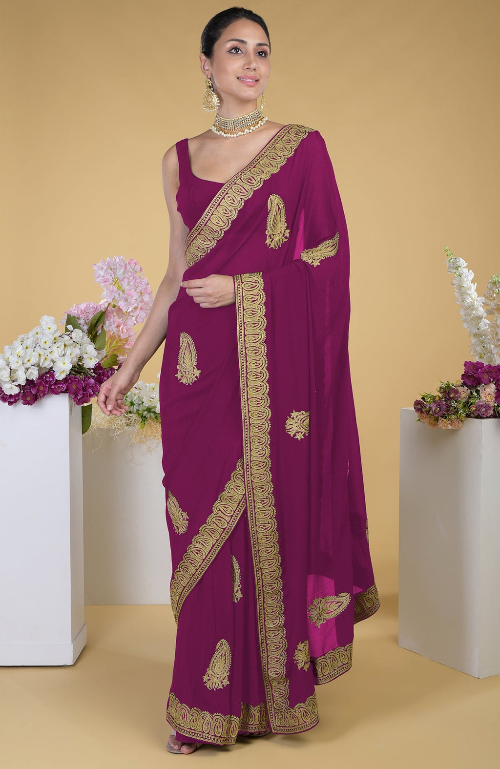 Peacock pink georgette saree with gold paisley Kashmiri tilla aari embroidery.