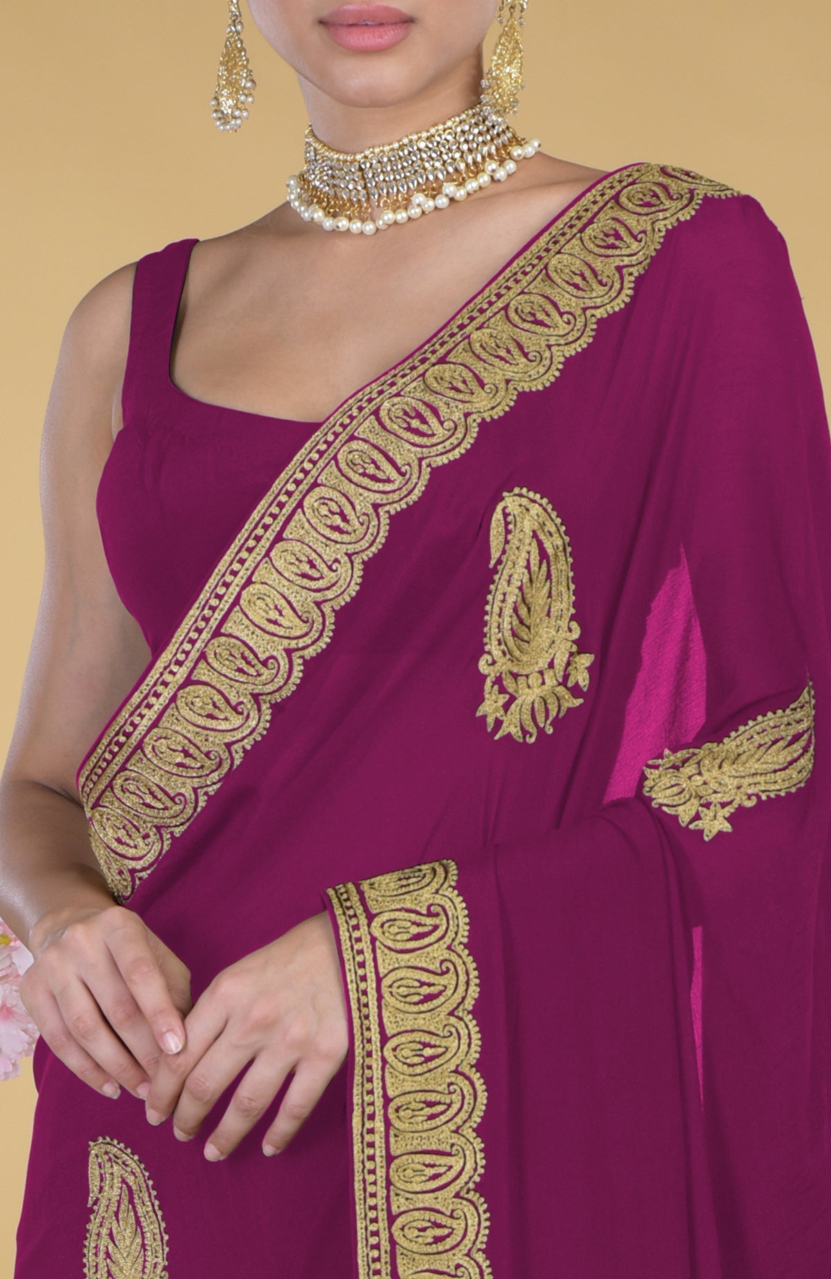 Peacock pink georgette saree with gold paisley Kashmiri tilla aari embroidery.