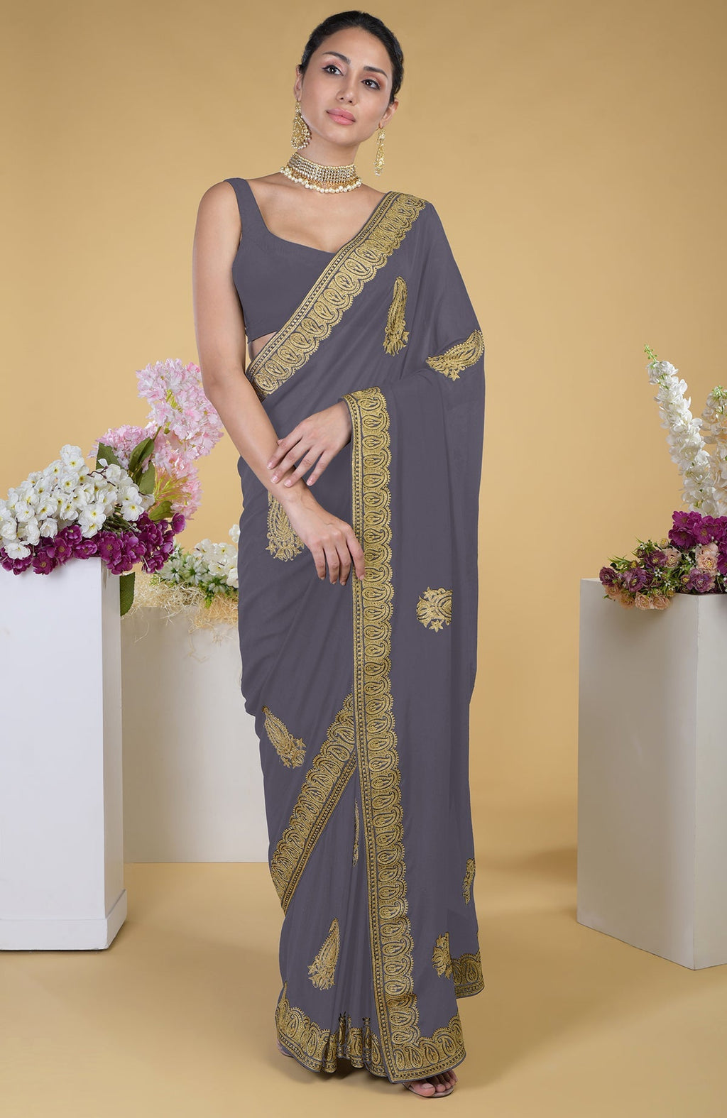 Pewter georgette saree with gold paisley Kashmiri tilla aari embroidery.