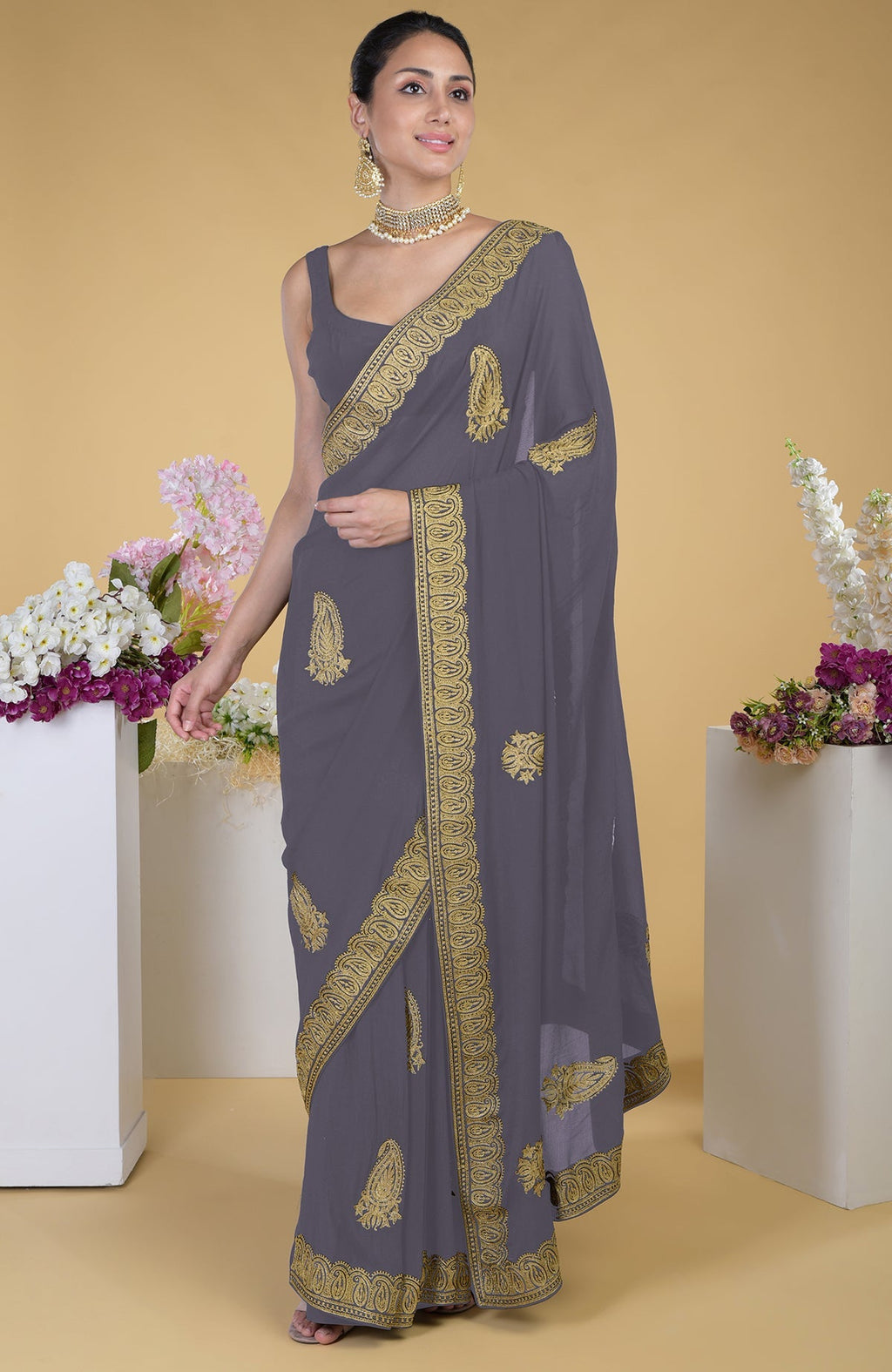 Pewter-gold Kashmiri tilla aari embroidered saree with paisley motifs.