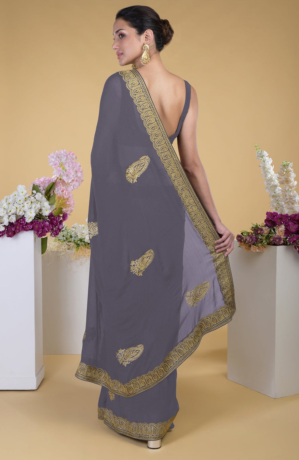 Pewter georgette saree with gold paisley Kashmiri tilla aari embroidery.