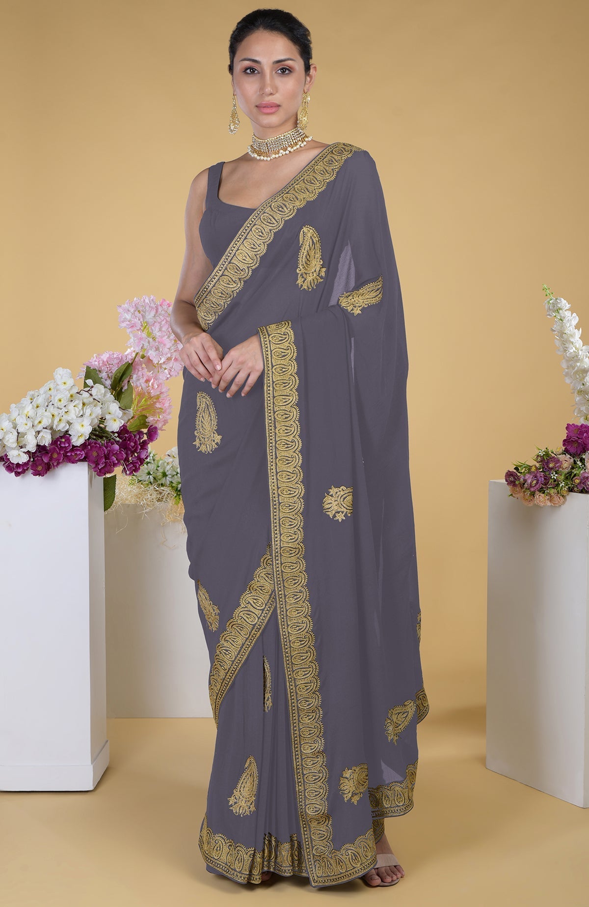 Peacock blue-gold Kashmiri tilla aari embroidered saree with a matching blouse.