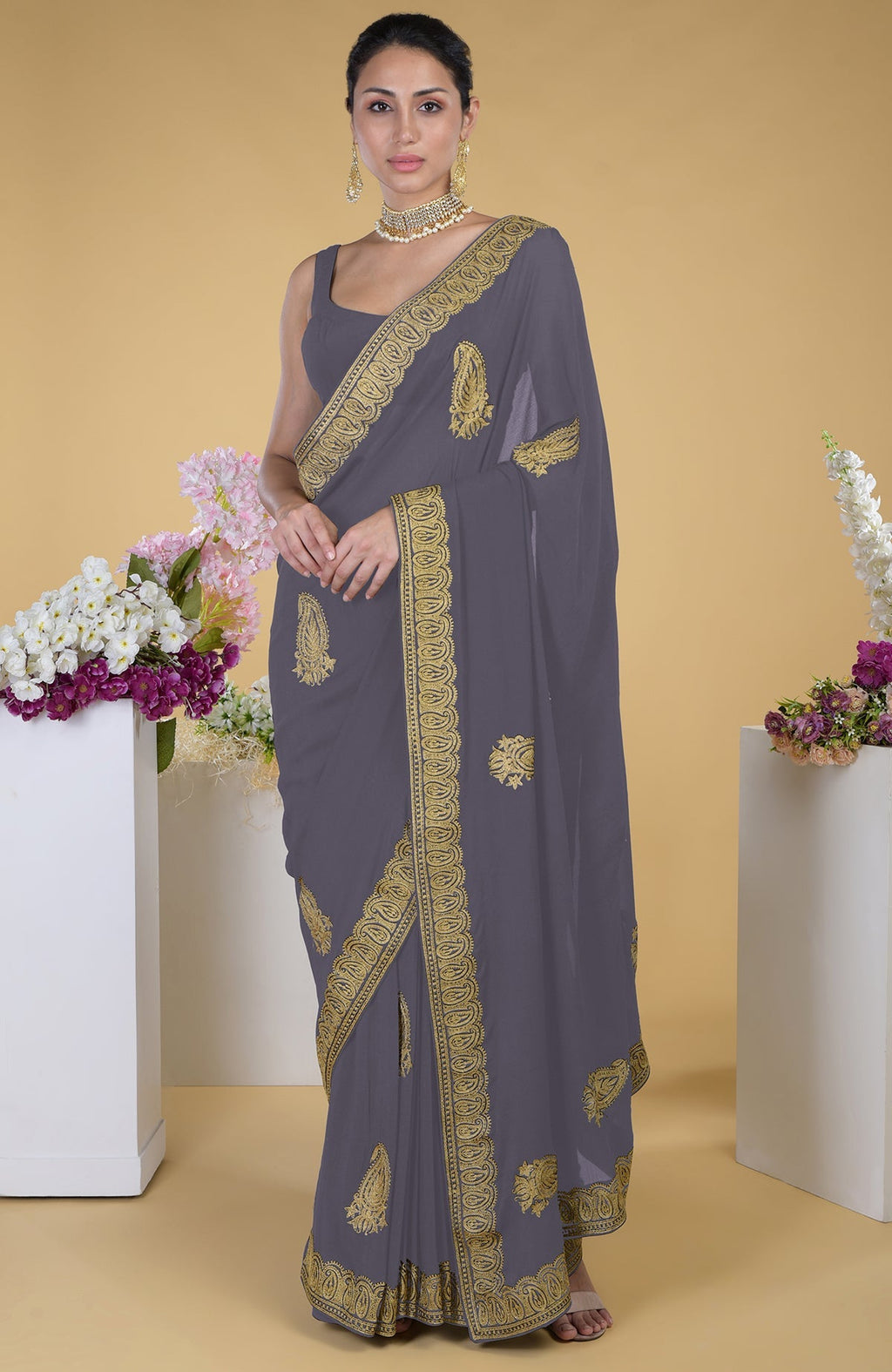 Pewter georgette saree with gold paisley Kashmiri tilla aari embroidery.