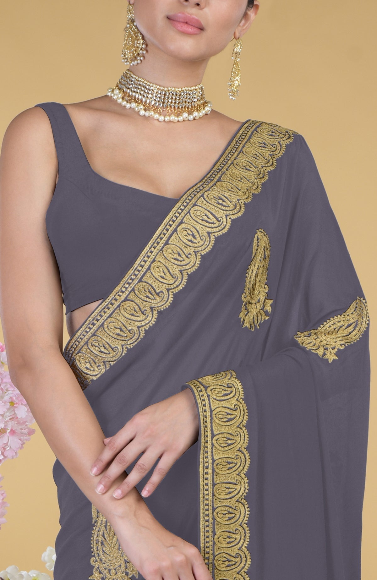 Pewter-gold Kashmiri tilla aari embroidered saree with matching blouse and jewelry.