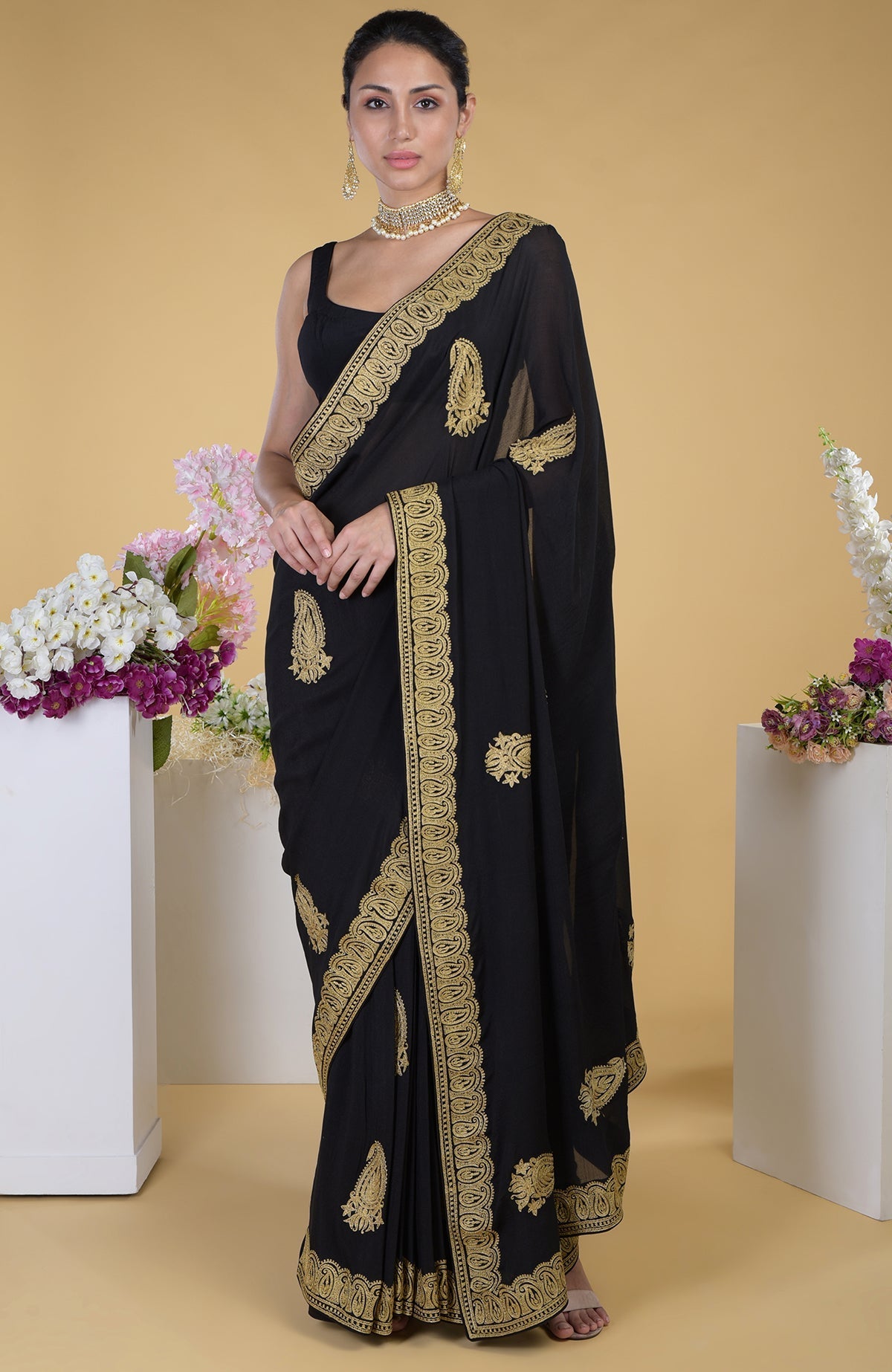 Black georgette saree with gold paisley Kashmiri tilla aari embroidery.