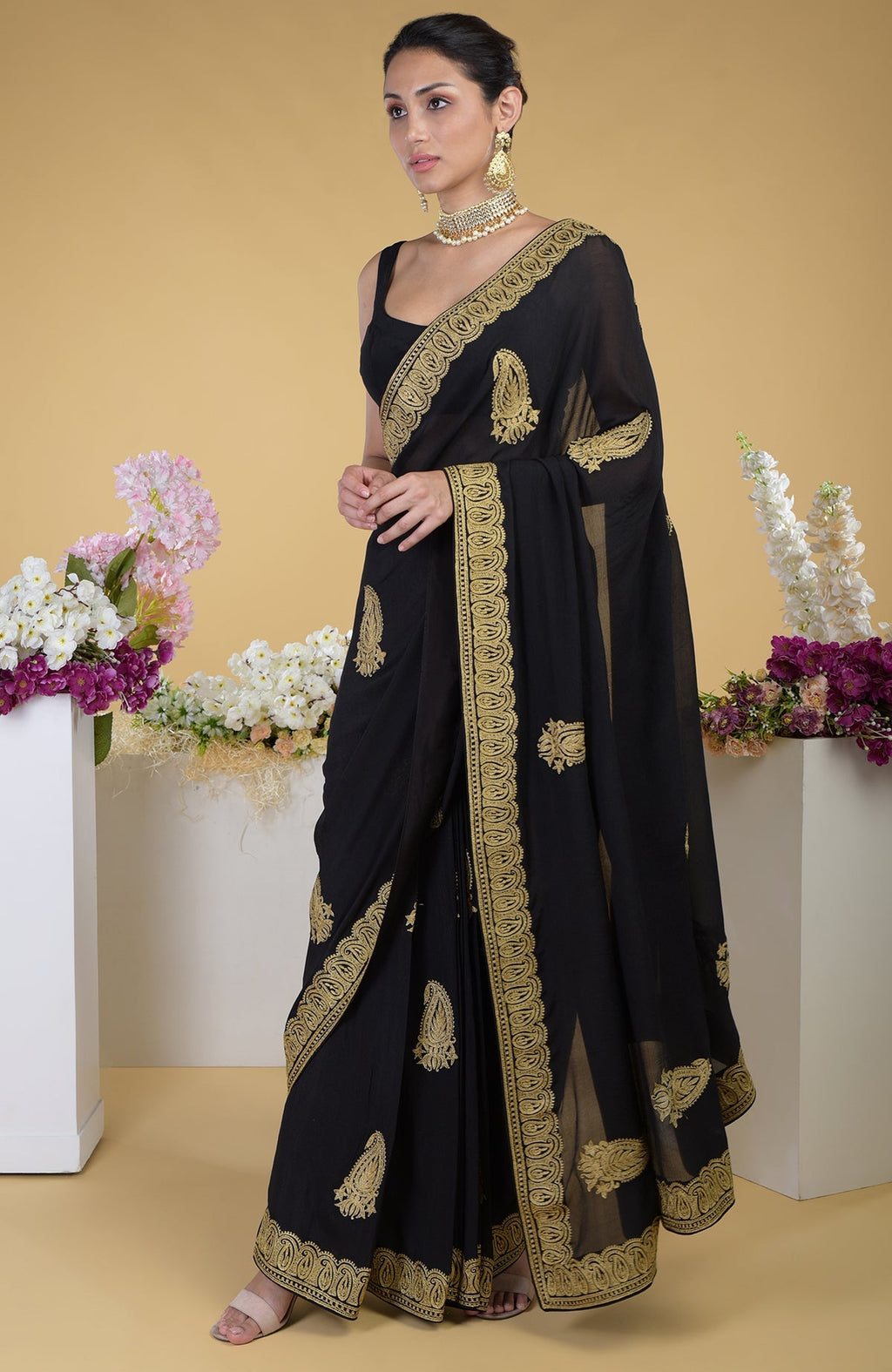 Black georgette saree with gold paisley Kashmiri tilla aari embroidery.