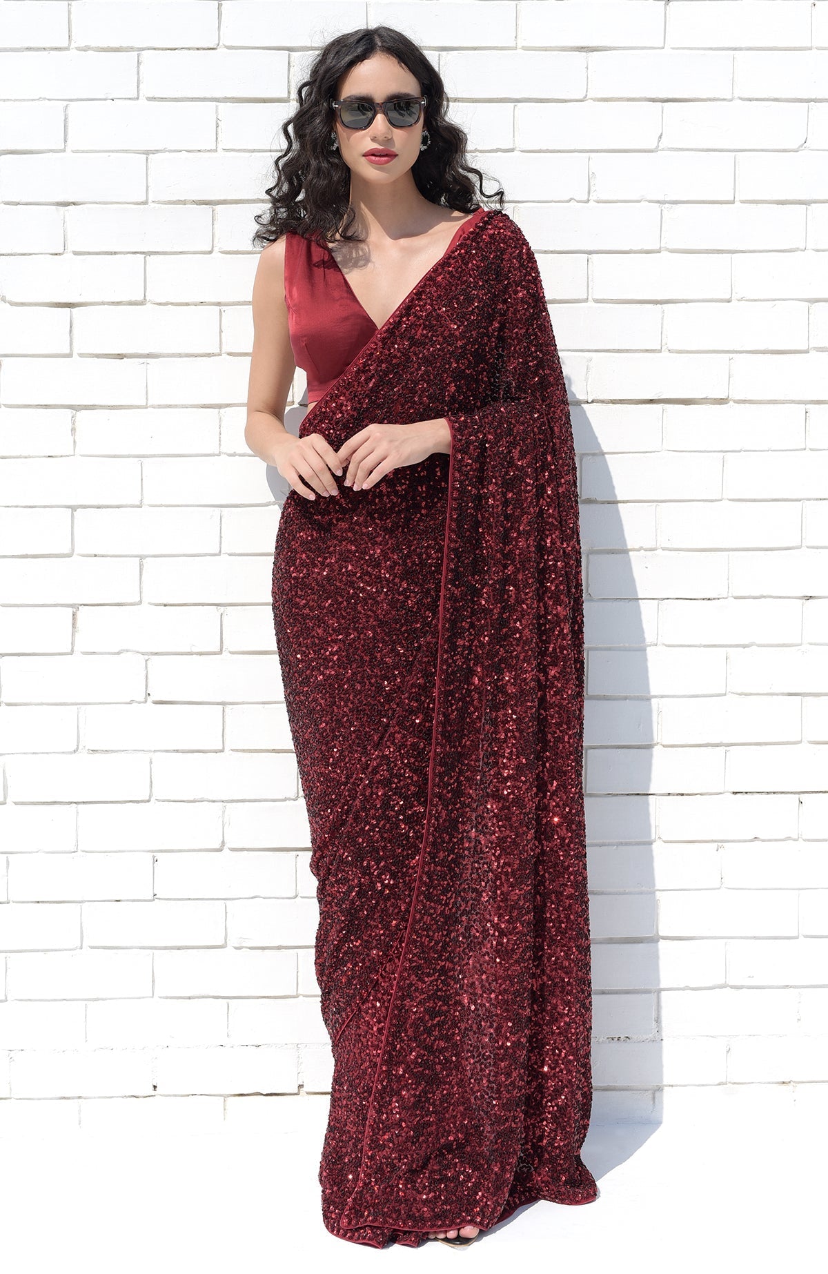 Red silk chiffon saree with hand-embroidered red dahlia sequins and floral borders.