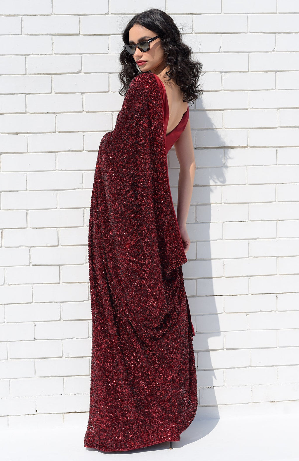 Red silk chiffon saree with hand-embroidered red dahlia sequins and floral borders.