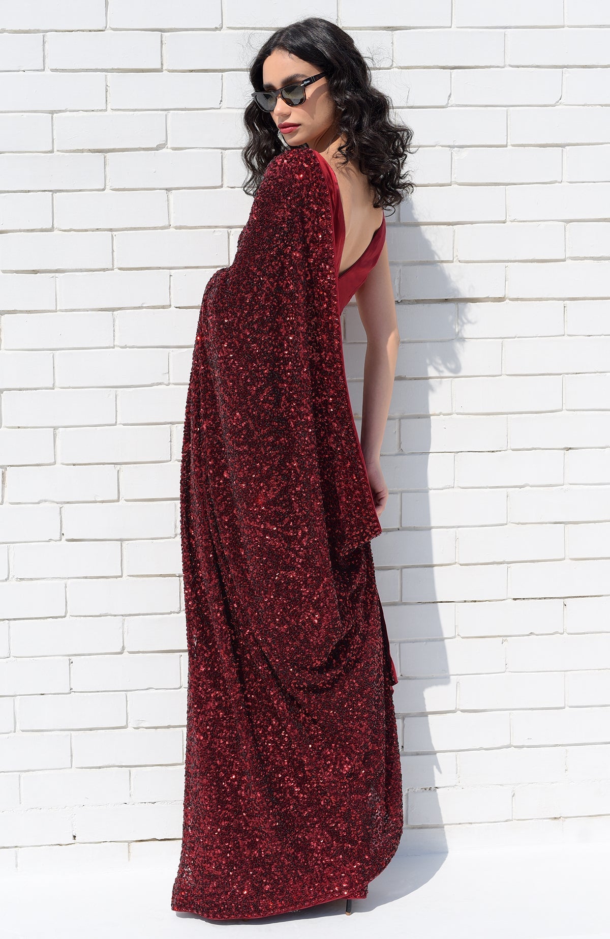 Red silk chiffon saree with hand-embroidered red dahlia sequins and floral borders.
