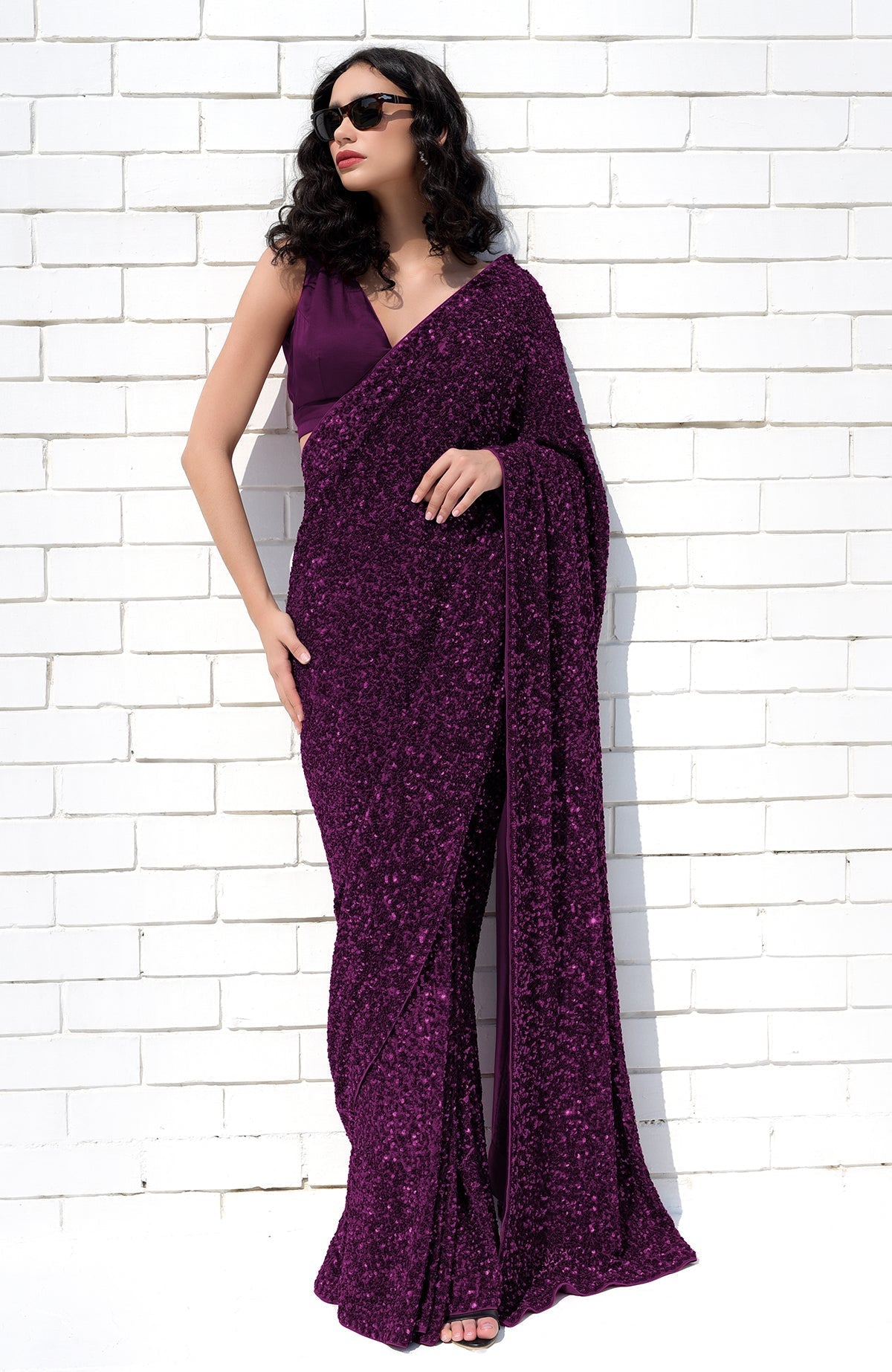 Purple sequin hand-embroidered saree with a matching satin blouse.