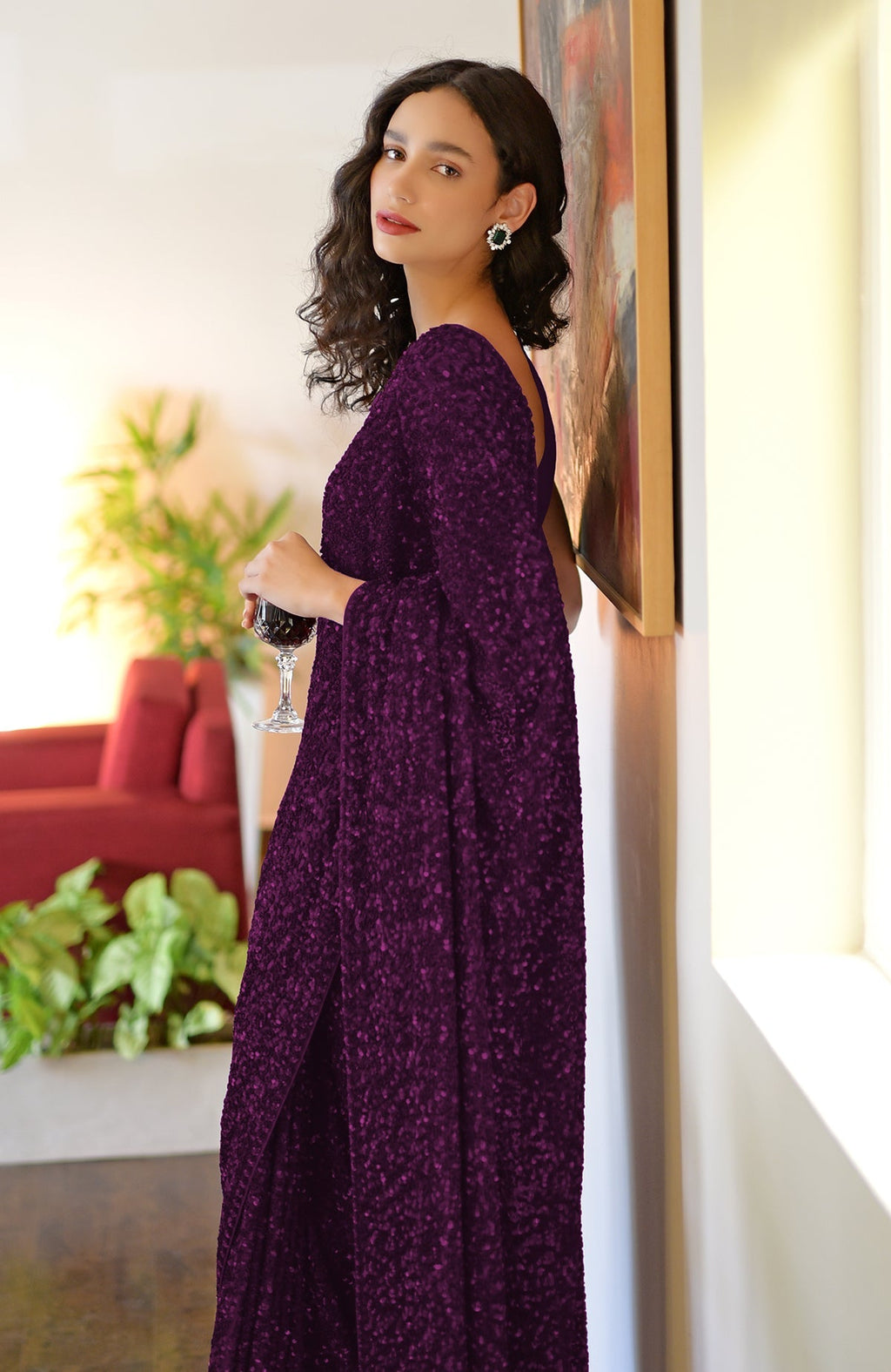 Purple sequin hand-embroidered saree with a V-neck blouse.