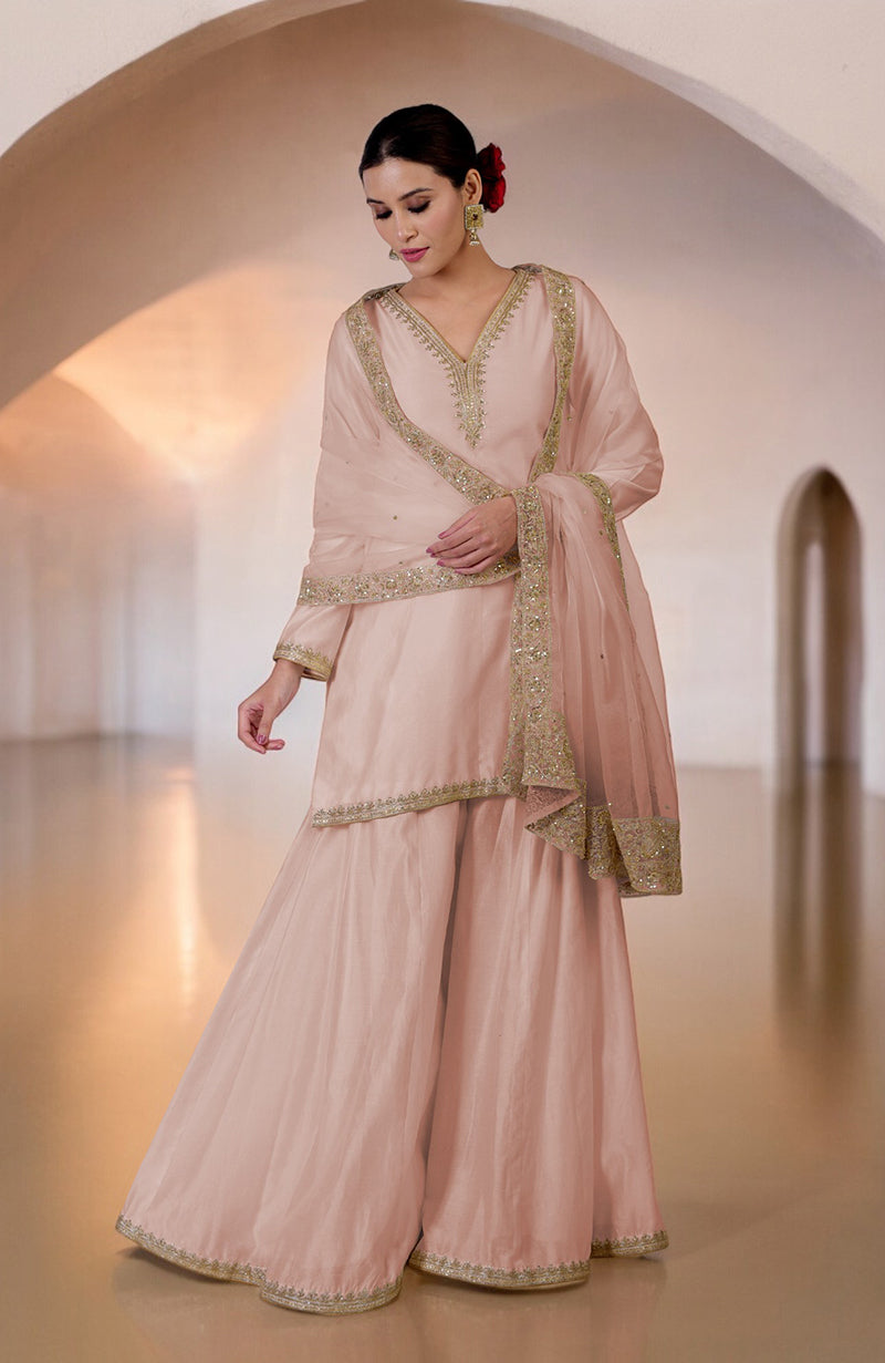 Oyster pink sharara set with gold marori and zardozi hand embroidery.