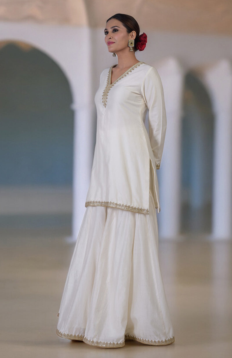 Ivory Marori & Zardozi hand embroidered sharara set with a V-neck kurta.