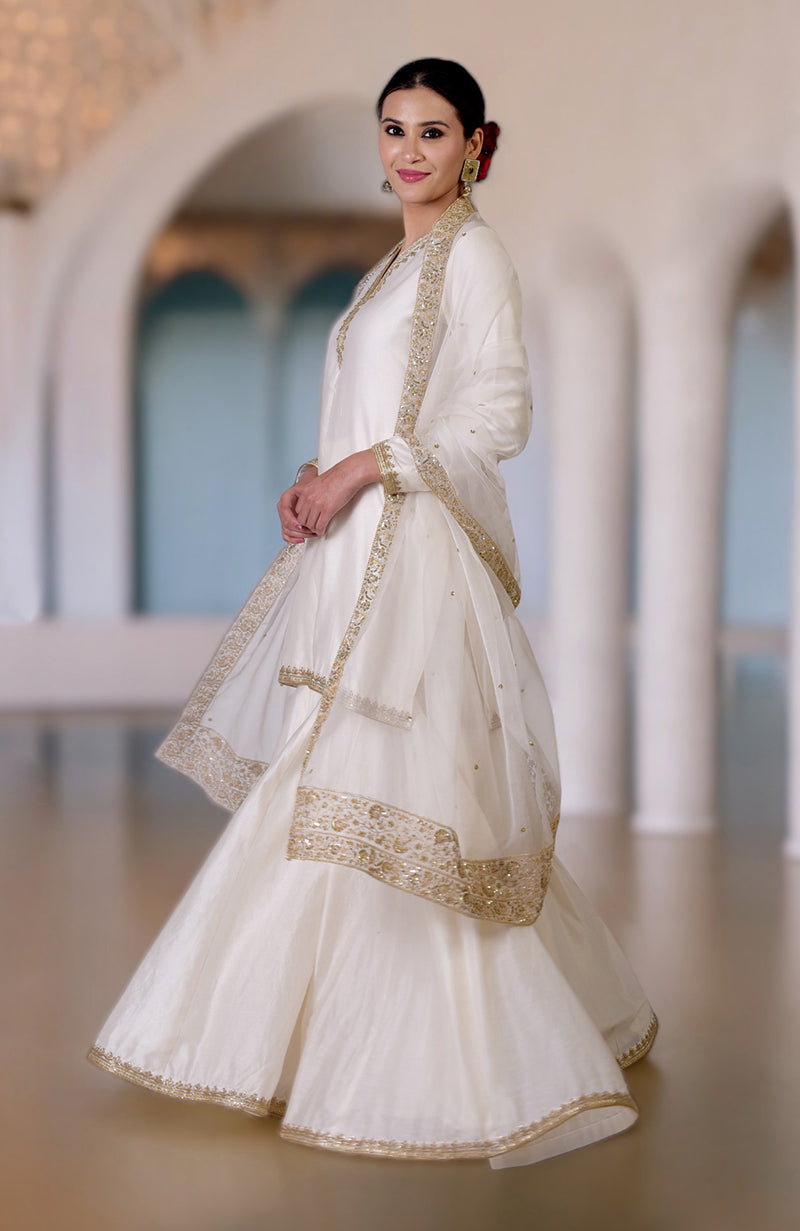 Ivory Marori & Zardozi Hand Embroidered Sharara Set with gold accents.