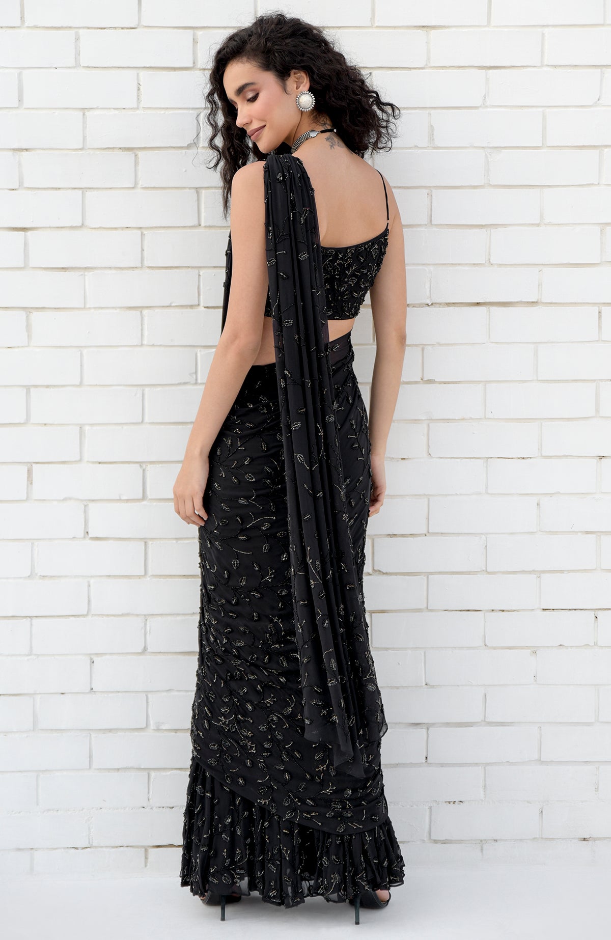Black mermaid cut gown saree with hand beaded floral embroidery and pleated pallav drape