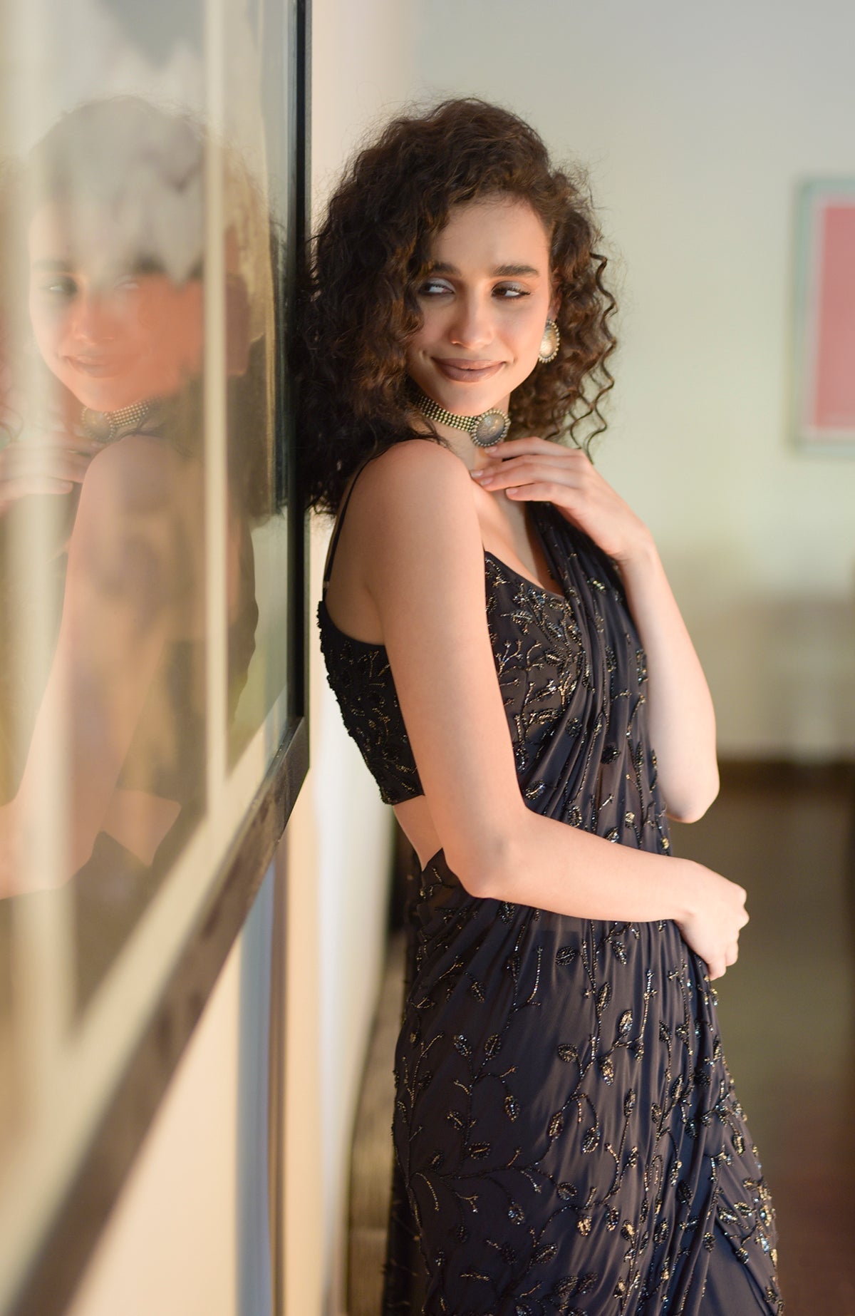 Black gown saree with hand beaded floral embroidery and pleated pallav drape on silk georgette
