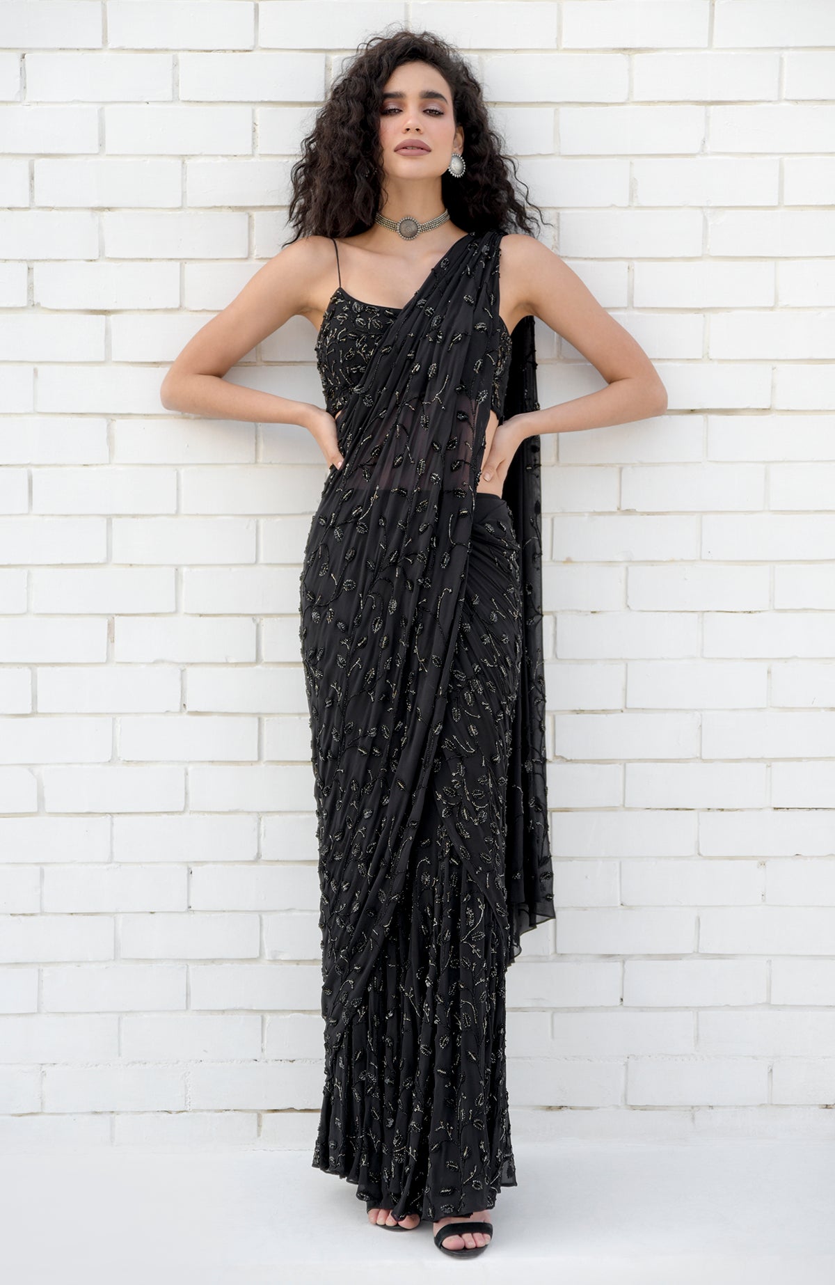 Black mermaid cut gown saree with hand beaded floral embroidery and pleated pallav drape