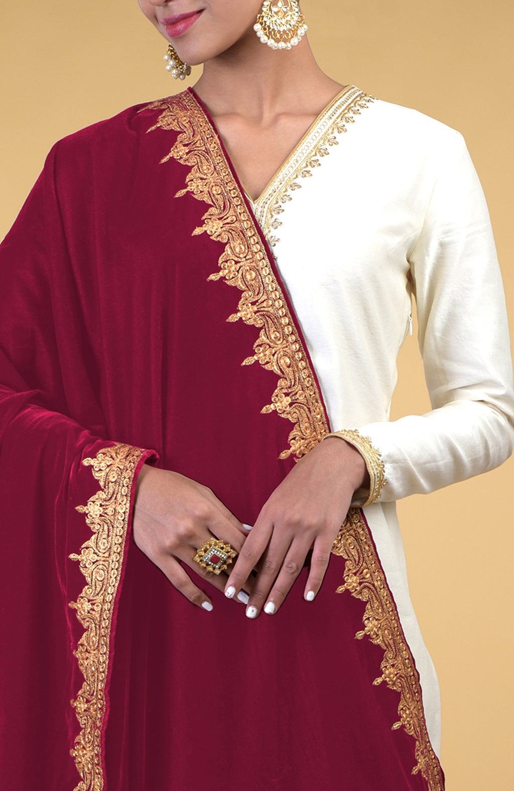 Claret Kashmiri Tilla embroidered dupatta shawl with gold embroidery on a white outfit.