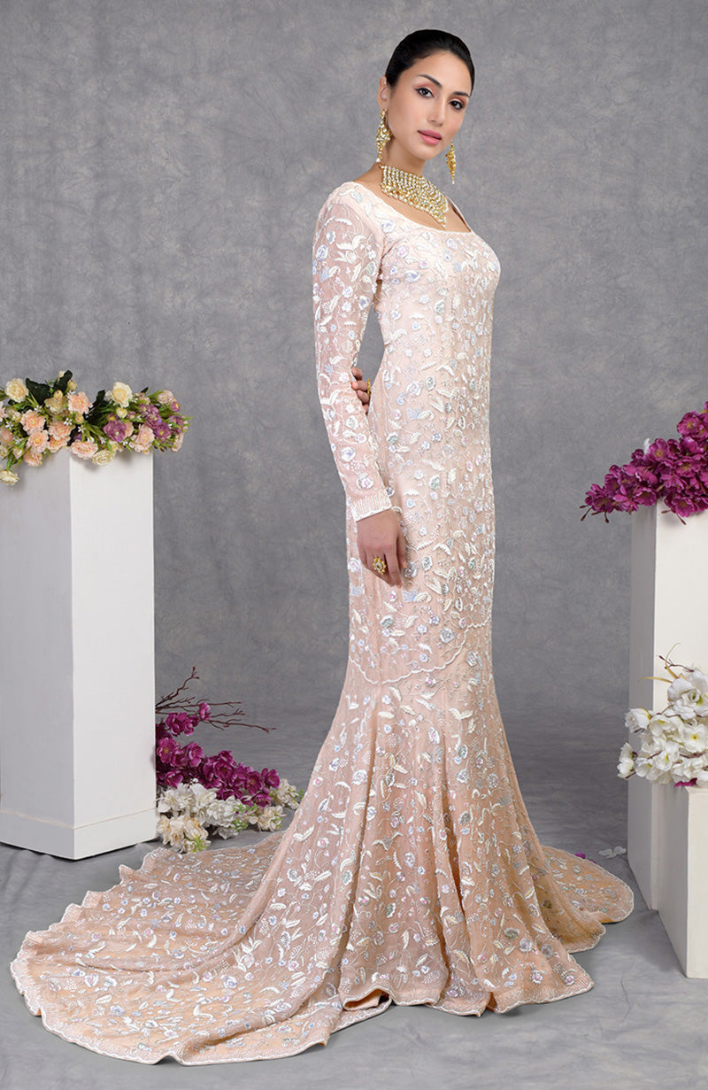 Fishcut gown with pastel floral embroidery on silk organza in soft mint, peach, and lavender shades.