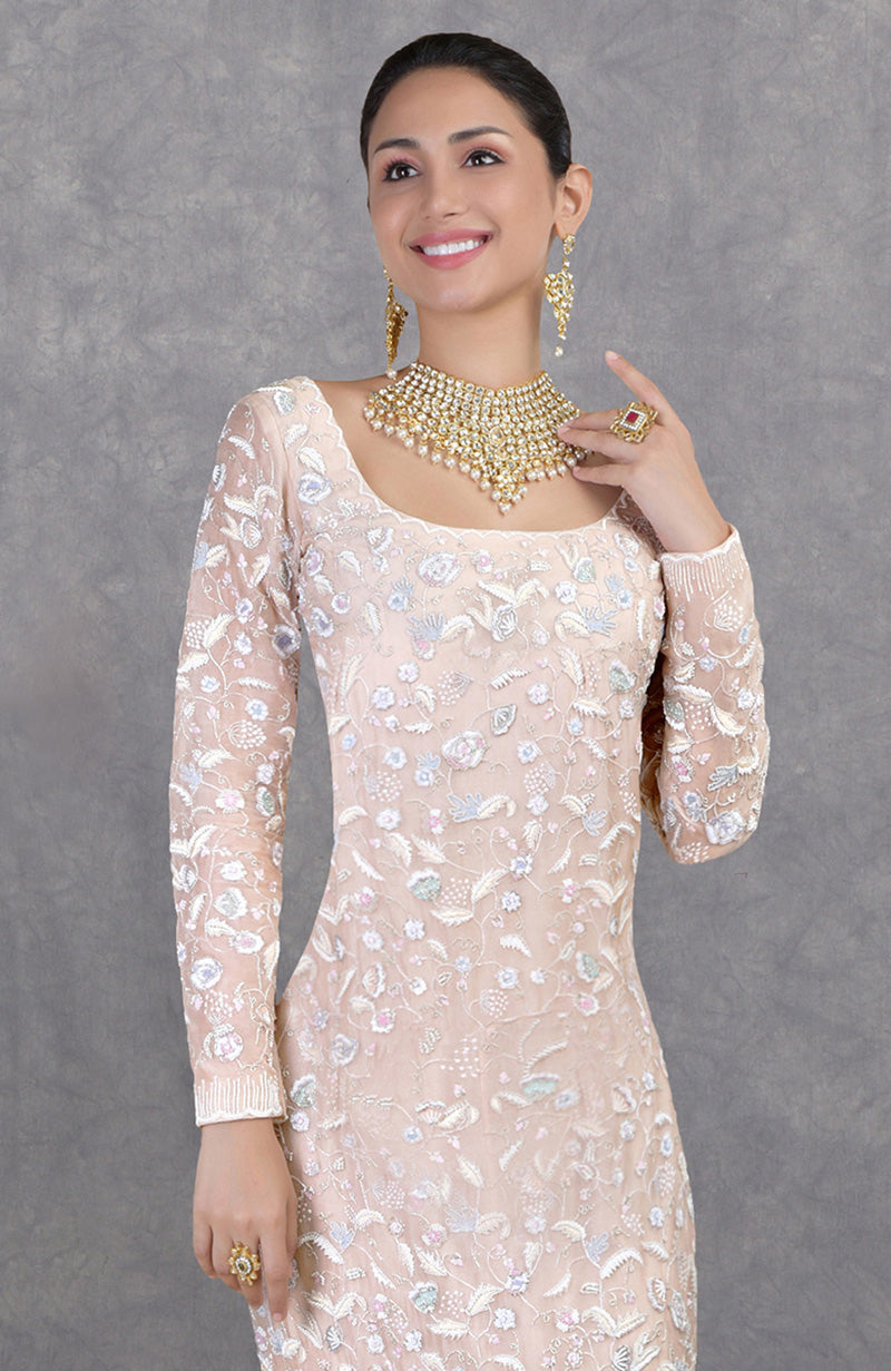 Pastel hand-embroidered silk organza fishcut gown with floral beadwork and a long trail.