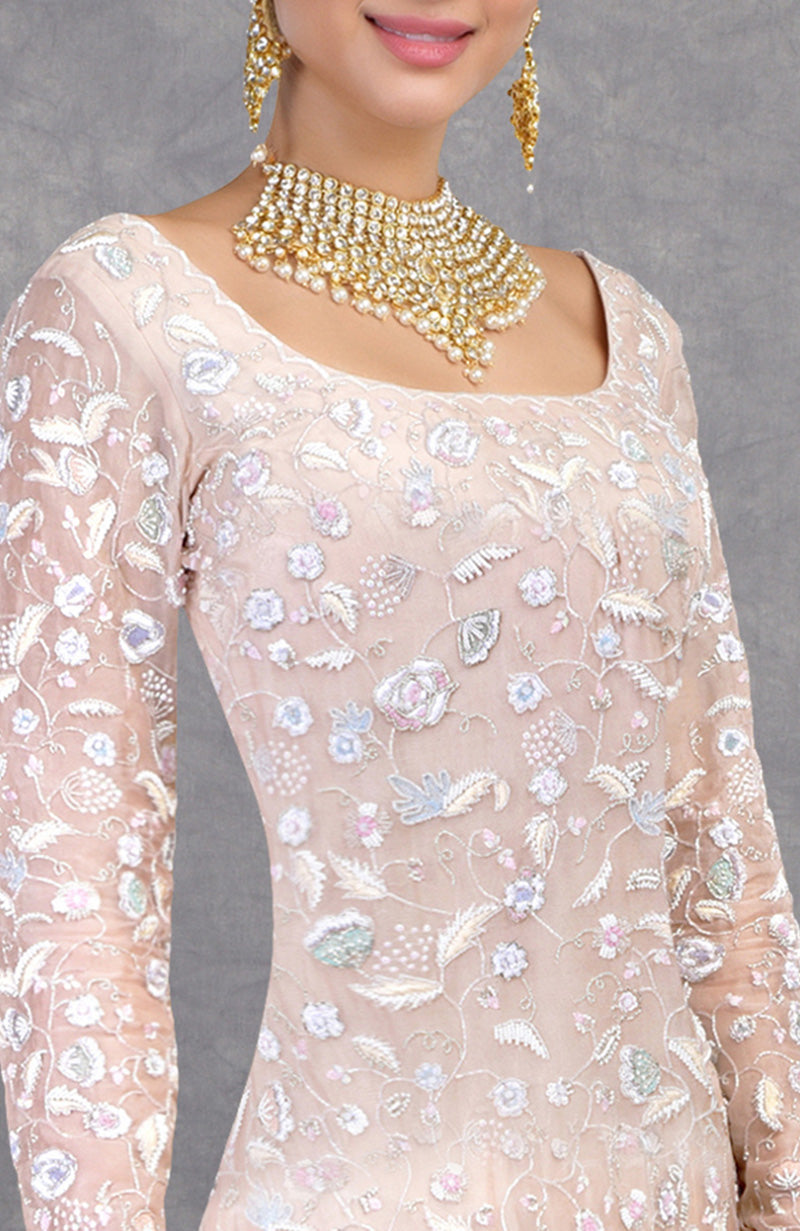 Delicate fishcut gown with pastel floral embroidery on silk organza and a graceful trail.