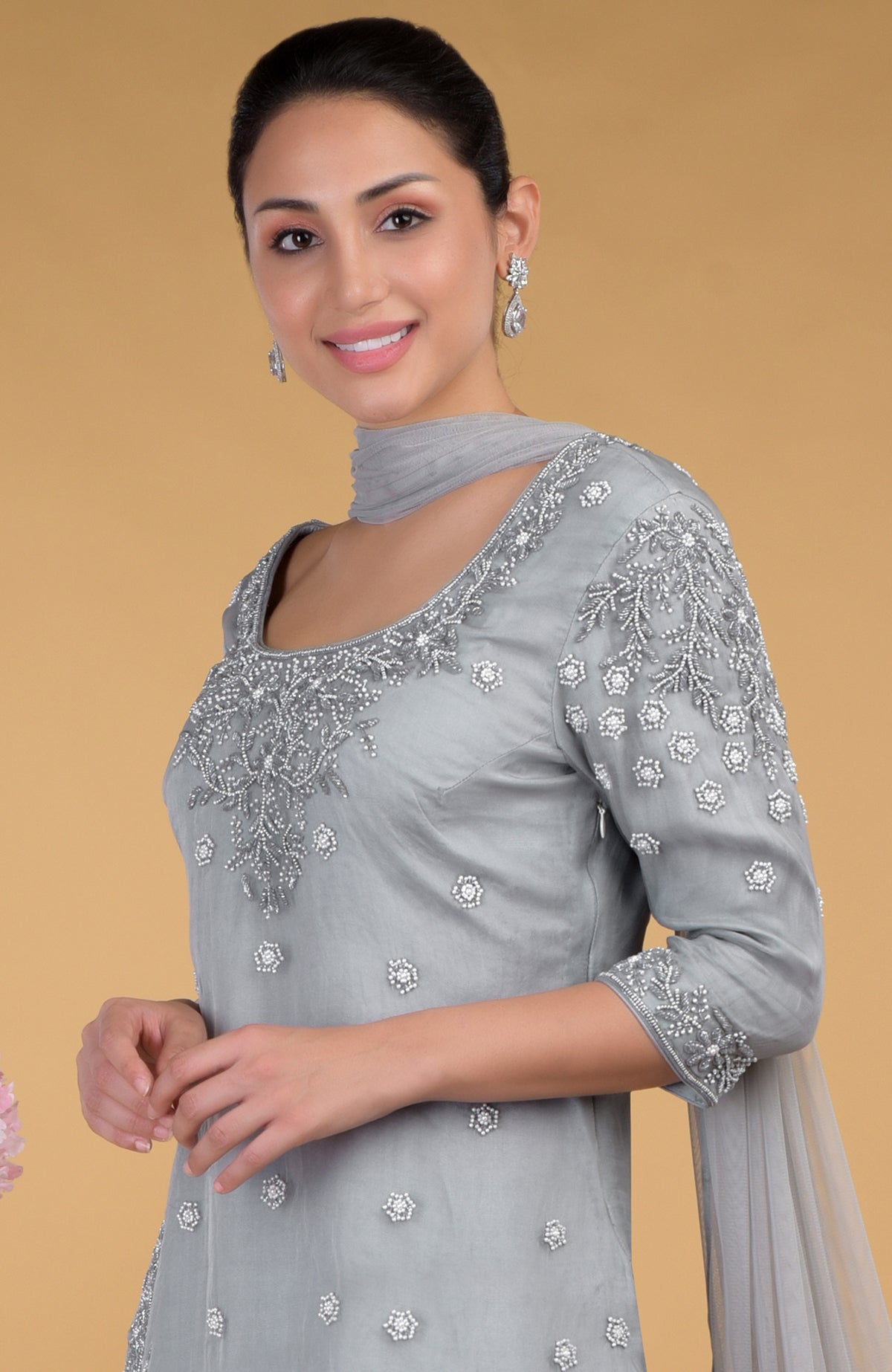 Grey silk organza kurta set with hand embroidery and pearl embellishments.