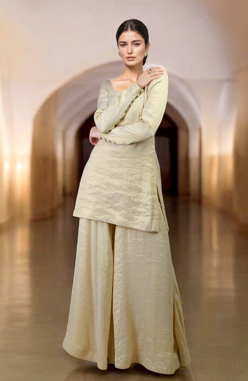 Gold tissue sharara suit with scoop neck kurta and flared sharara pants in handwoven fabric