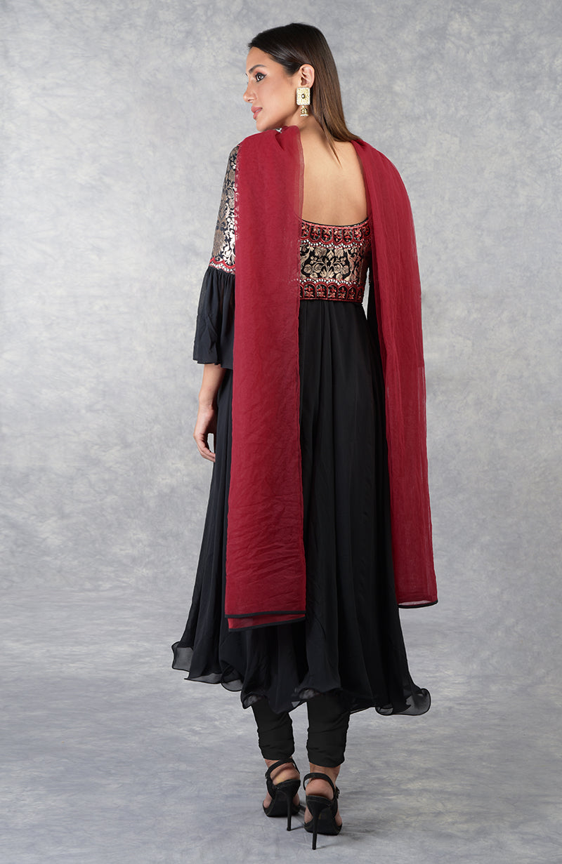 Black Anarkali set with gold brocade yoke and black-red beaded embroidery, paired with churidar and red dupatta