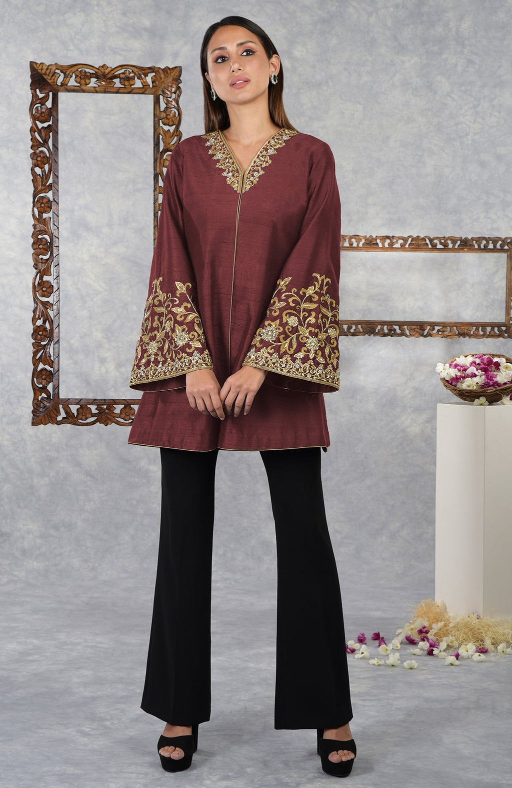 Pomegranate raw silk jacket with gold hand embroidery, paired with black pants.