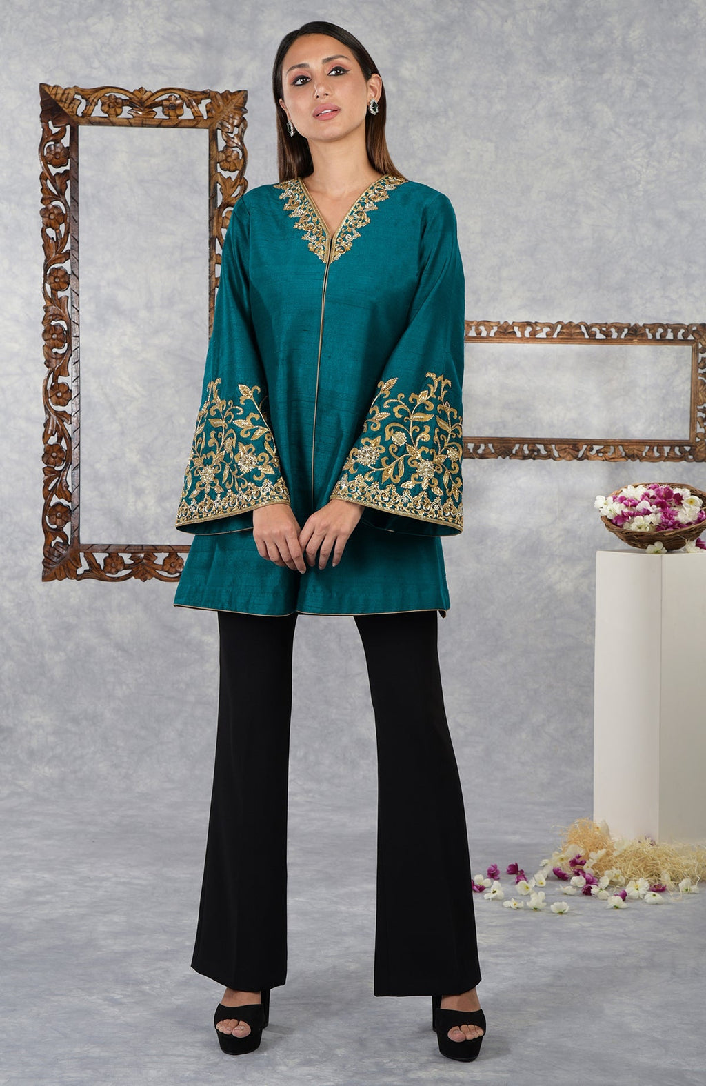 Deep teal raw silk jacket with gold hand embroidery on the neckline and sleeves.