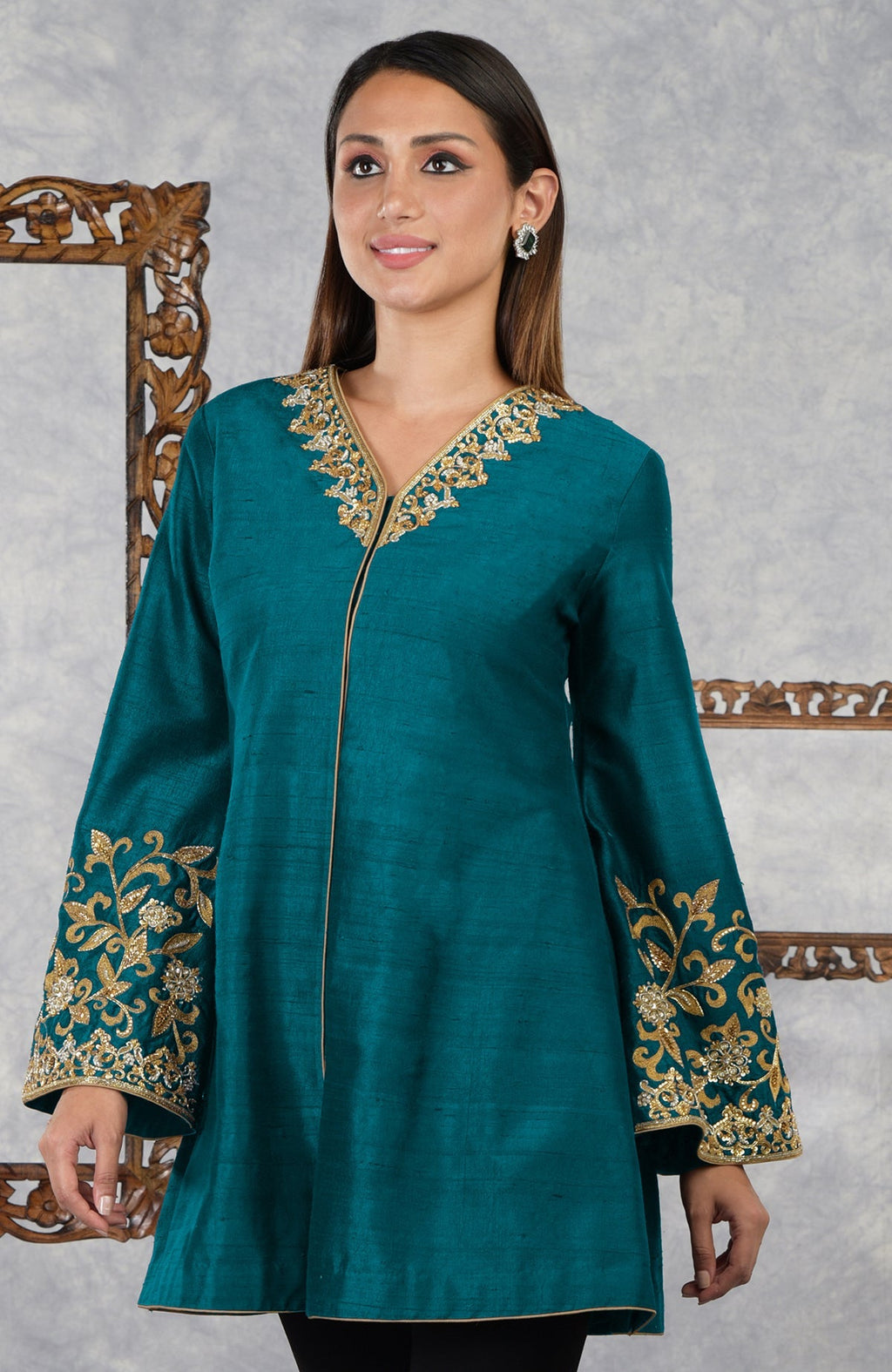 Deep teal raw silk hand-embroidered jacket with gold embellishments.