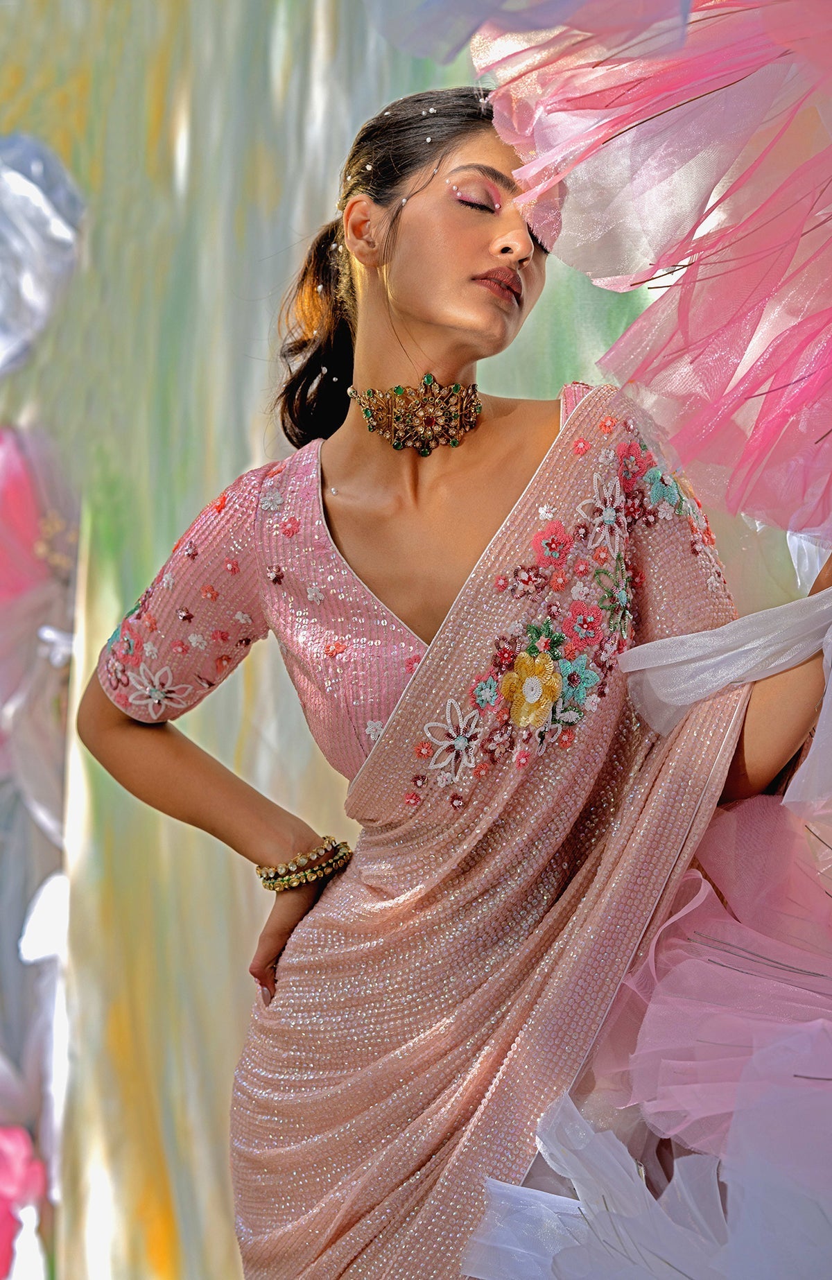 Pink champagne floral sequin hand-embroidered saree with a matching blouse.