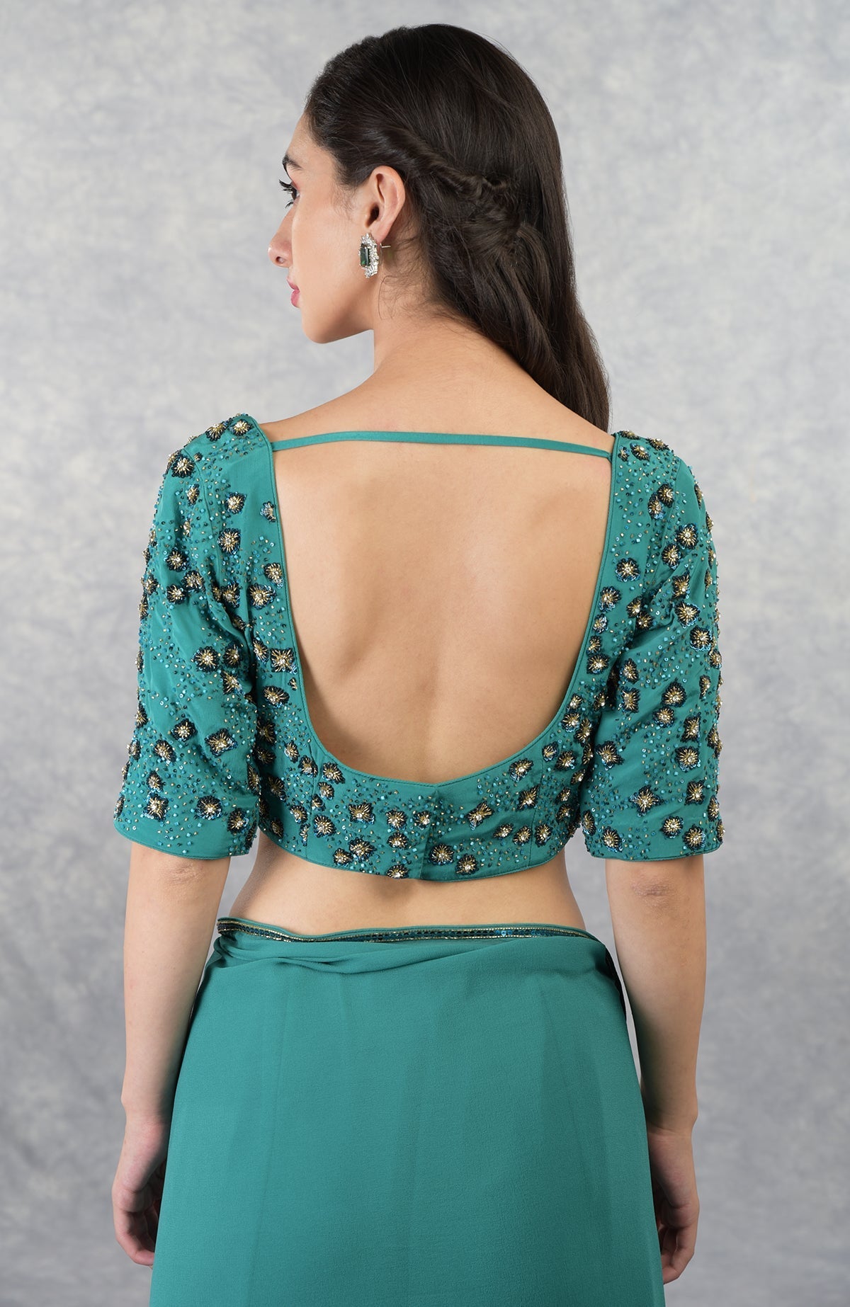 Blue hand-embroidered pure georgette blouse with a deep U-shaped back.
