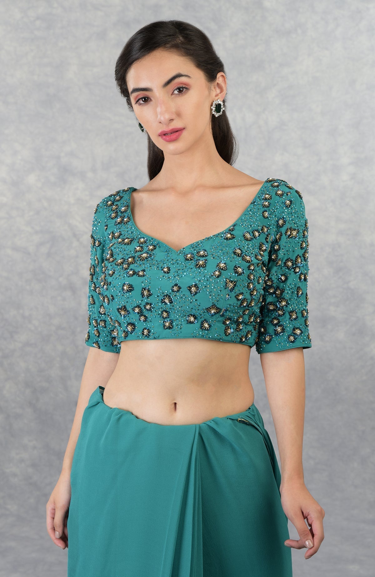 Blue hand-embroidered pure georgette blouse with a sweetheart neckline.