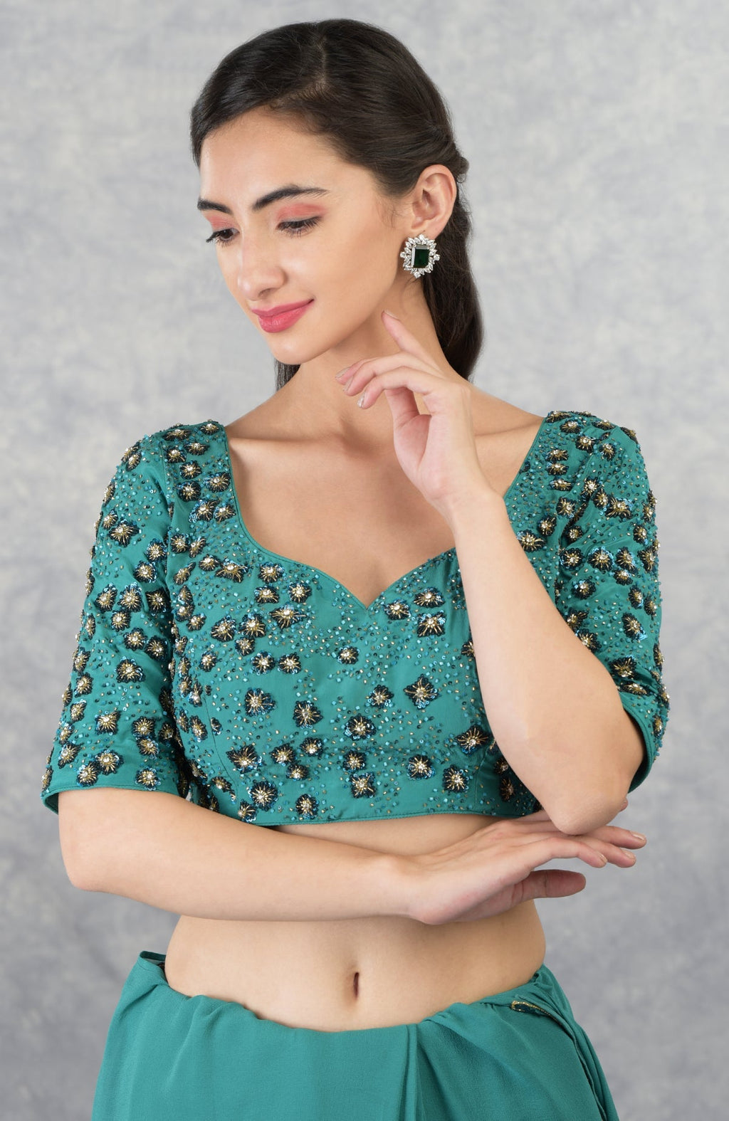 Blue hand embroidered pure georgette blouse with a sweetheart neckline.