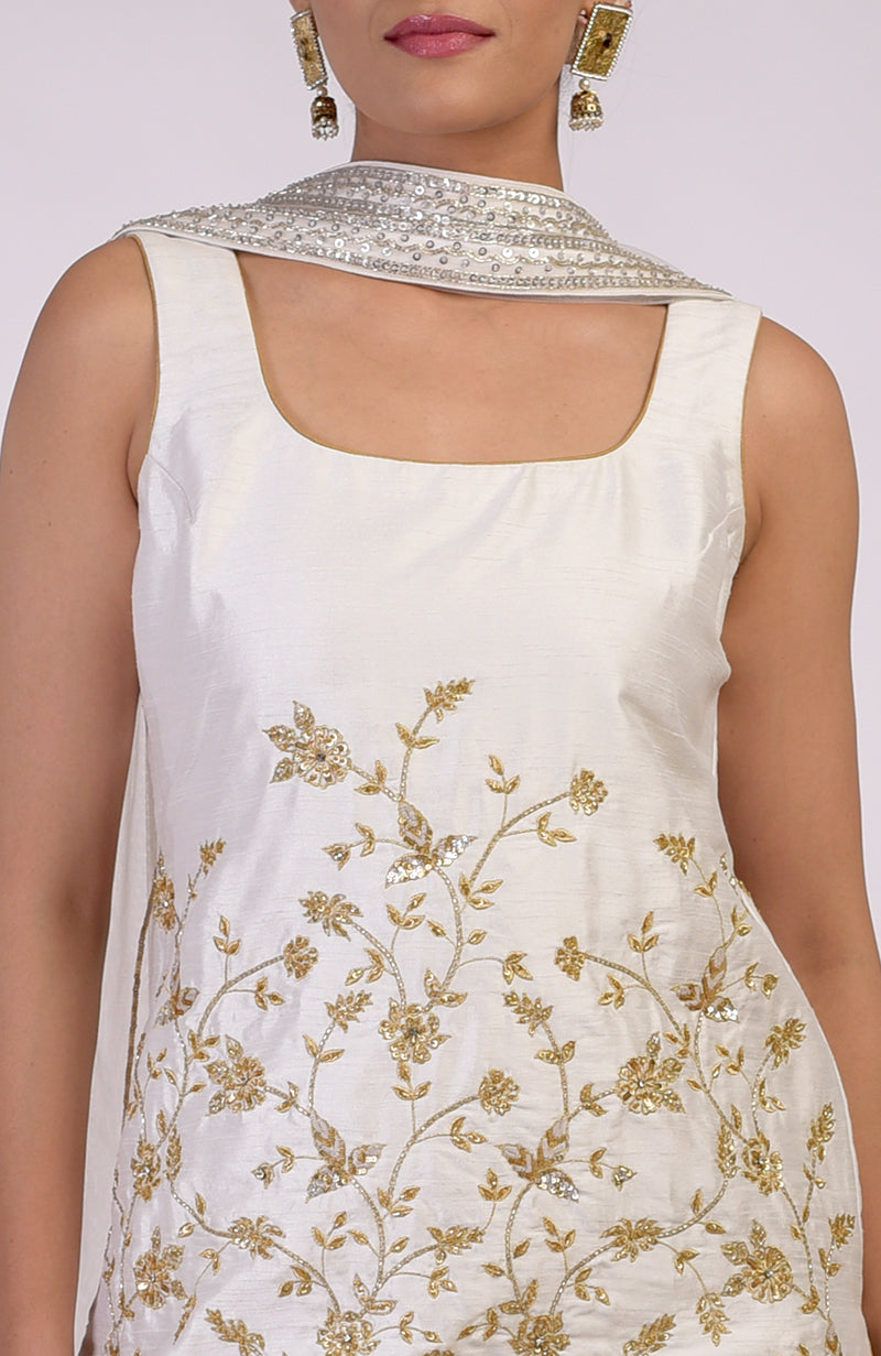 White-gold hand-embroidered raw silk-tulle sharara set with floral motifs and sequins.