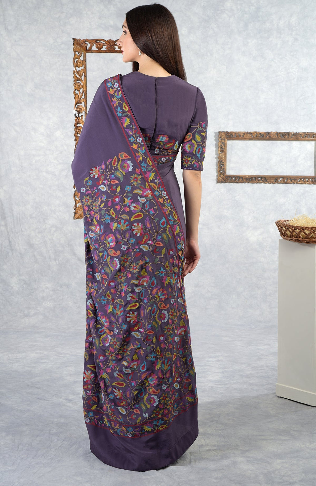 An Eclipse Kashmir Kani Art Embroidered Saree with Blouse is shown from the back.