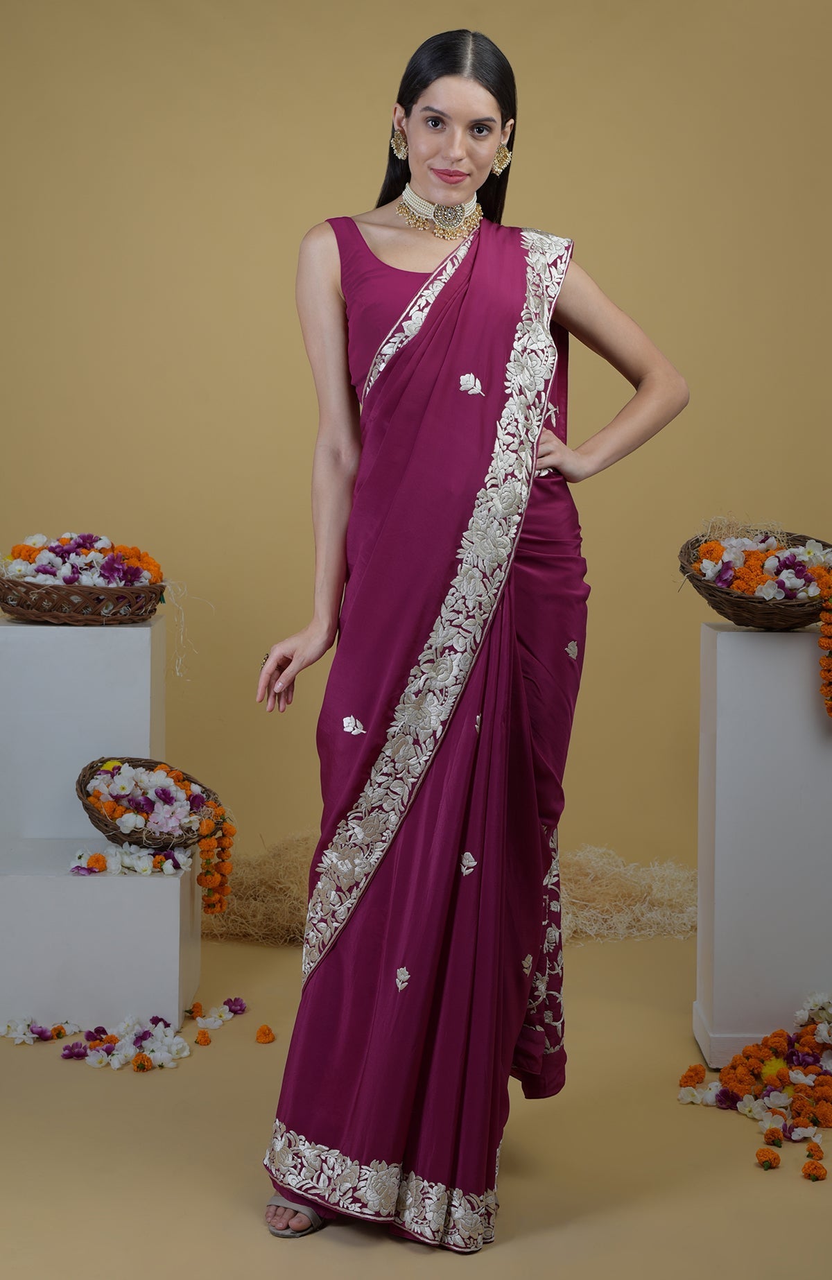 Peacock pink Parsi Gara hand embroidered saree with intricate floral designs.