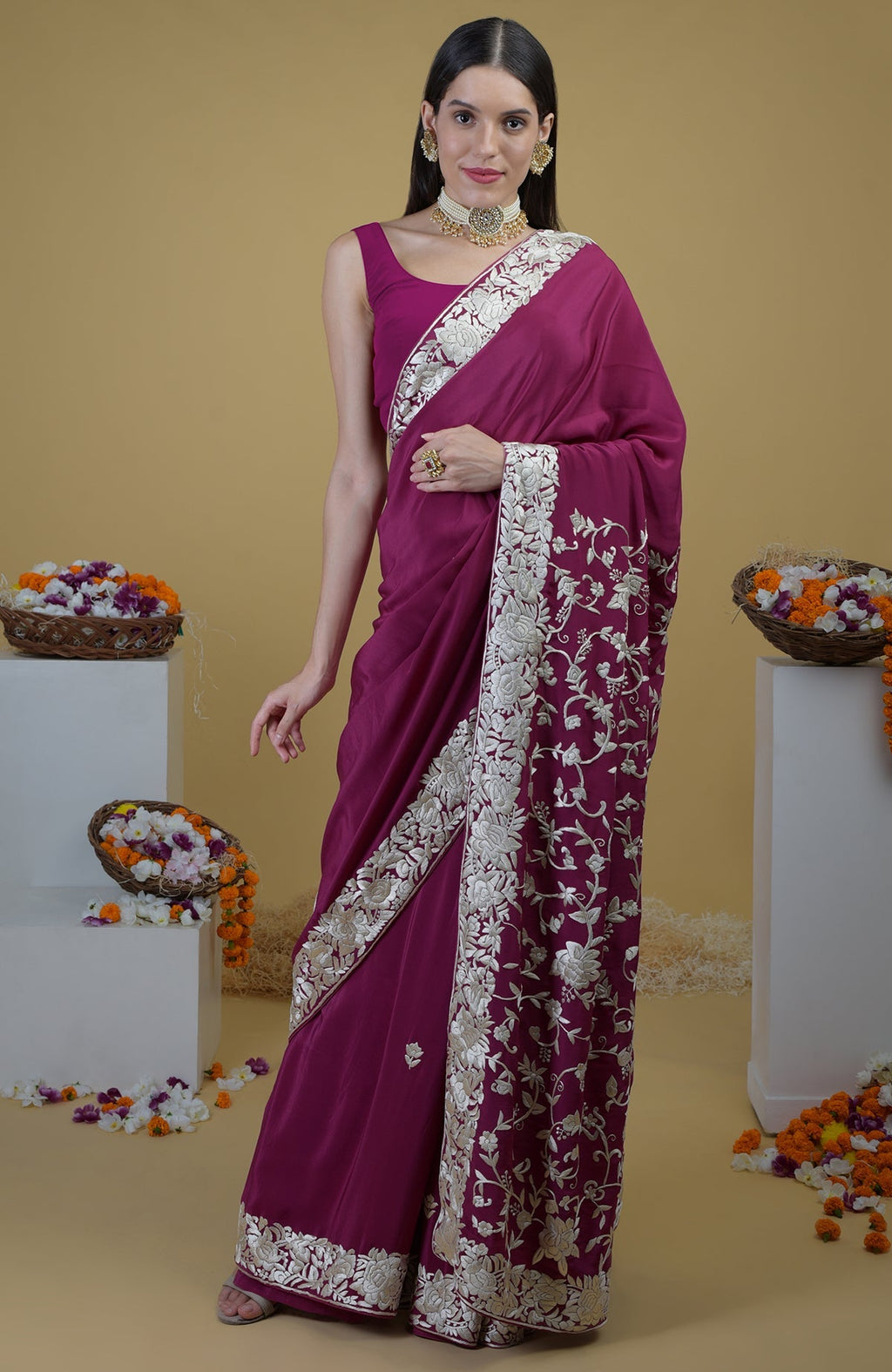Peacock pink Parsi Gara hand embroidered saree with intricate floral designs.