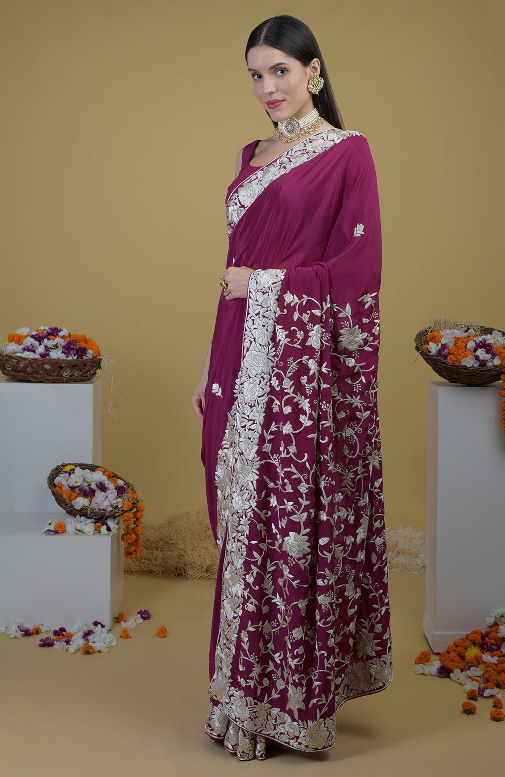 Peacock pink Parsi Gara hand embroidered saree with intricate ivory floral patterns.